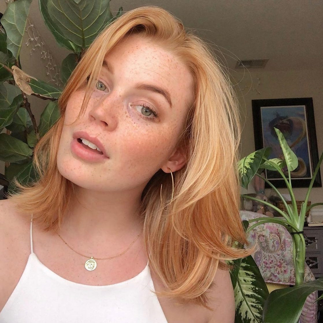 15. Softly Feathered Medium Cut with Classic Strawberry Blonde (Strawberry Blonde Hair Color)