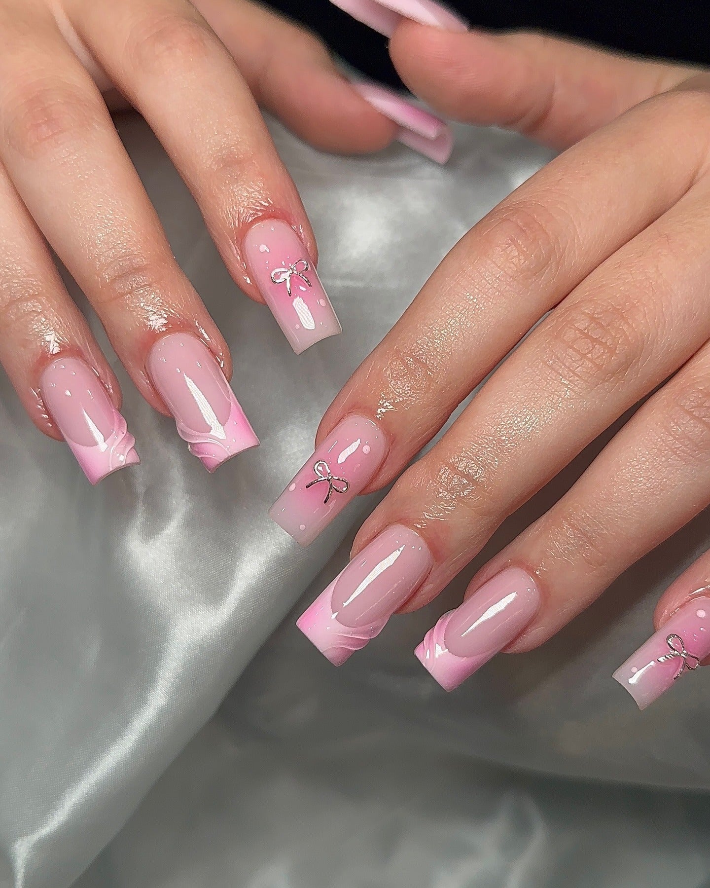 4. Classic Pink Bows with Subtle Swirls (Nail Ideas for Work)
