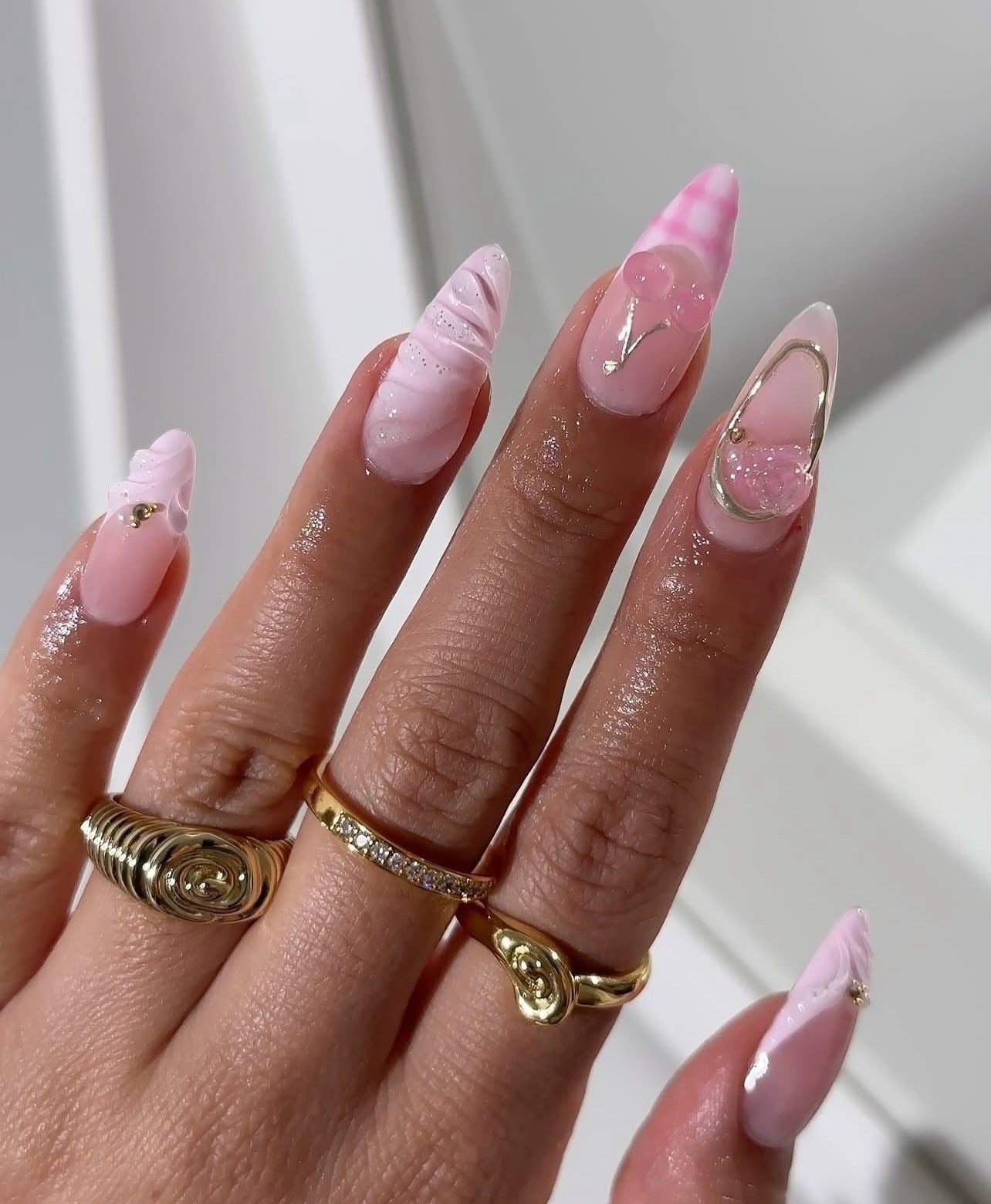 12. Glossy Marble Pink with Textured Art (Nail Ideas for Work)