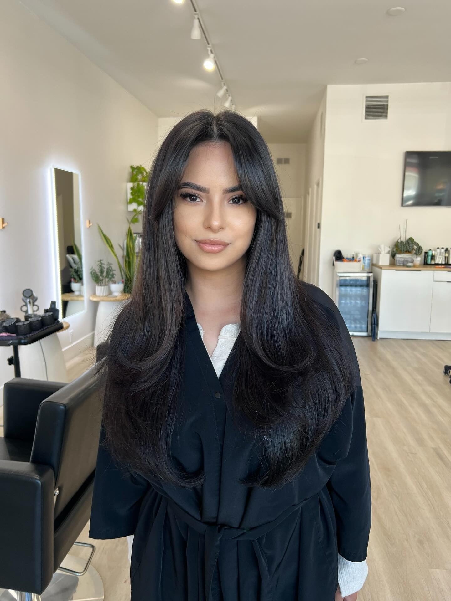 3. Silky Midnight Black with Long, Flowing Layers (Face-Framing Haircuts)