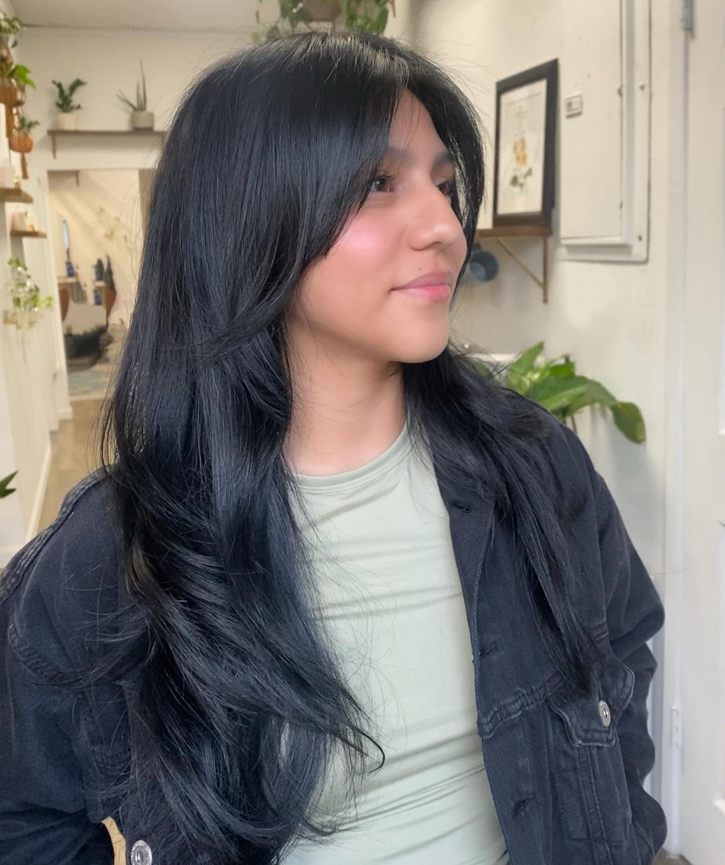 4. Natural Black Waves with Feathered Ends (Face-Framing Haircuts)