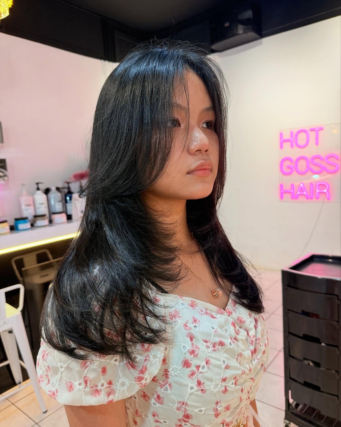 6. Black with Wispy Curtain Fringe and Layered Ends (Face-Framing Haircuts)