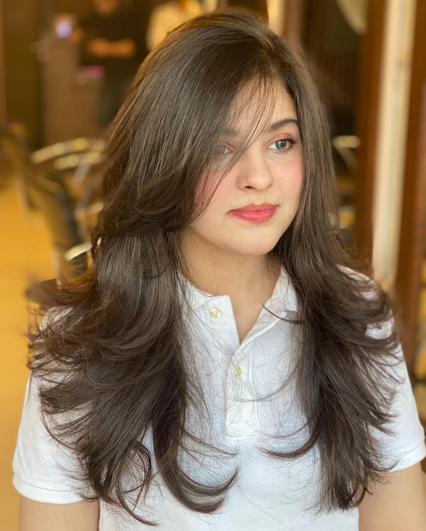 9. Chestnut Brown with Light Feathering (Face-Framing Haircuts)