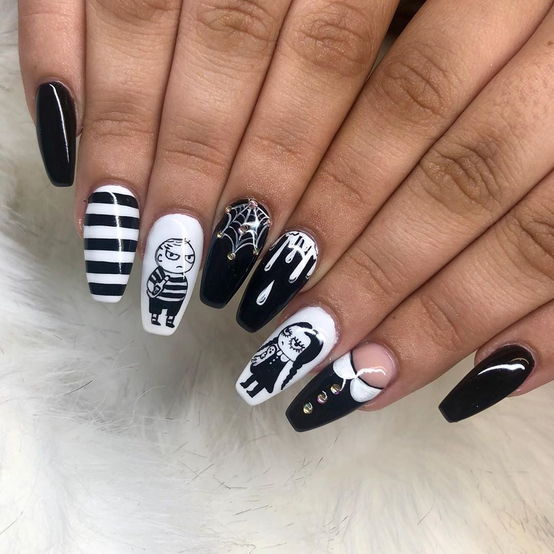 5. Cartoon Goth Duo with Web and Drip Accents (Grunge Nail Ideas)