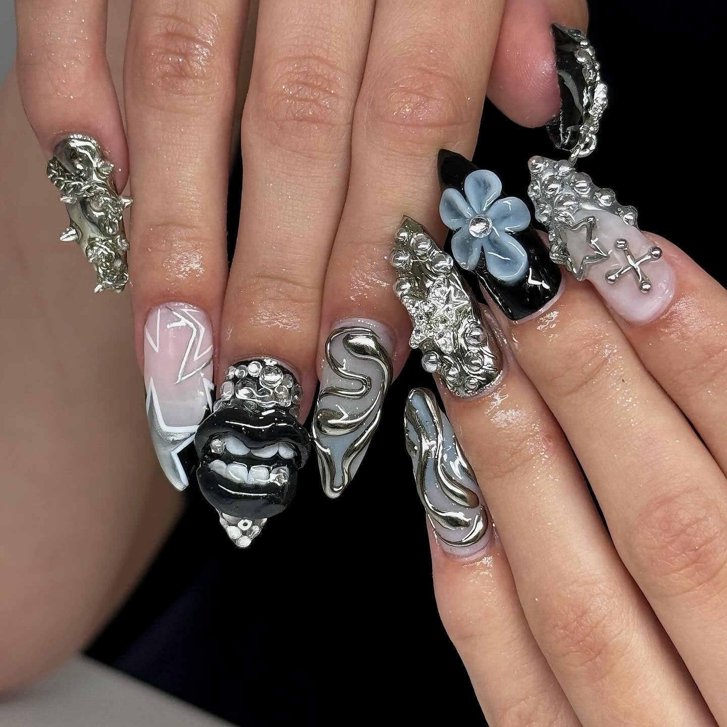 6. 3D Chrome Armor and Mixed Motifs (Grunge Nail Ideas)