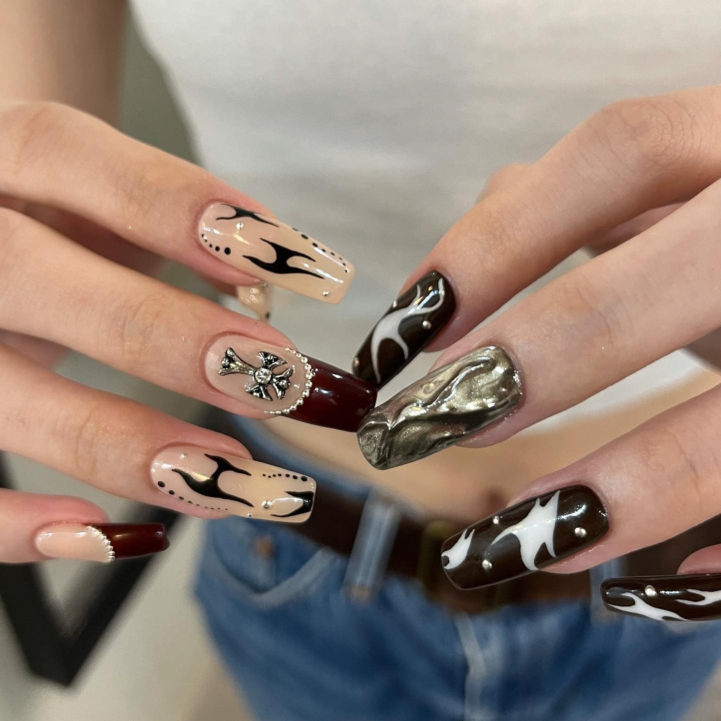 14. Desert Flame with Cross and Chrome Accent (Grunge Nail Ideas)