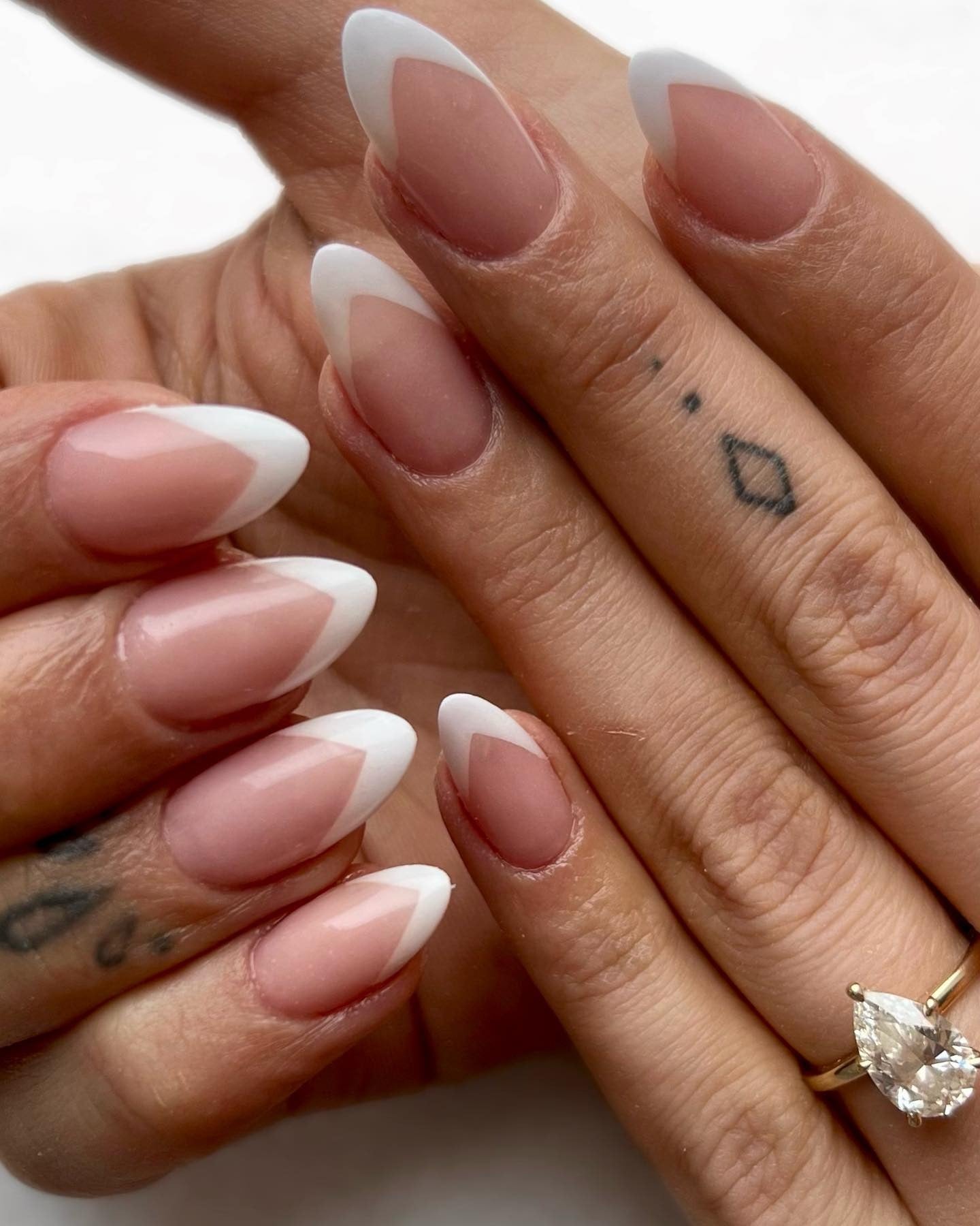 9. Geometric Almond French with Angled Tips (French Manicure Nail Ideas)
