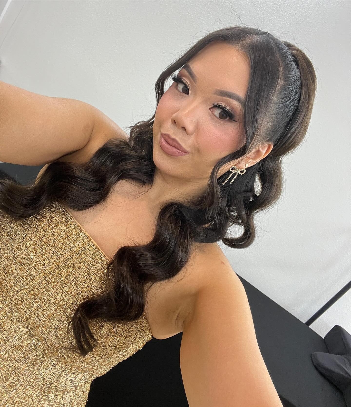 13. Sleek High Ponytail with Glossy Waves (Birthday Hairstyles)