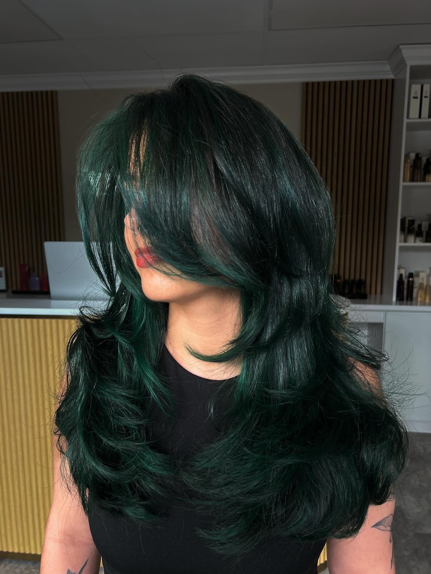 3. Deep Green Feathered Blowout (Green Hair Color)
