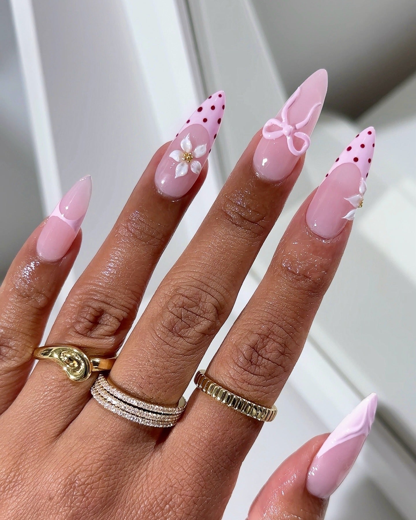 14. Playful Pink Stilettos with Bows and Flowers (Pink and White Nail Ideas)