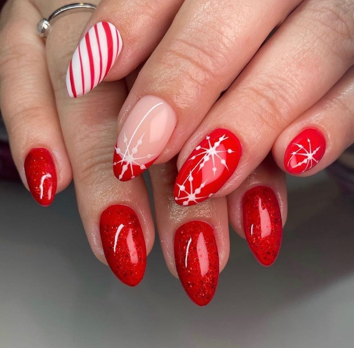 15. Red Sparkle with Candy Cane Twist (Holiday Nail Ideas)