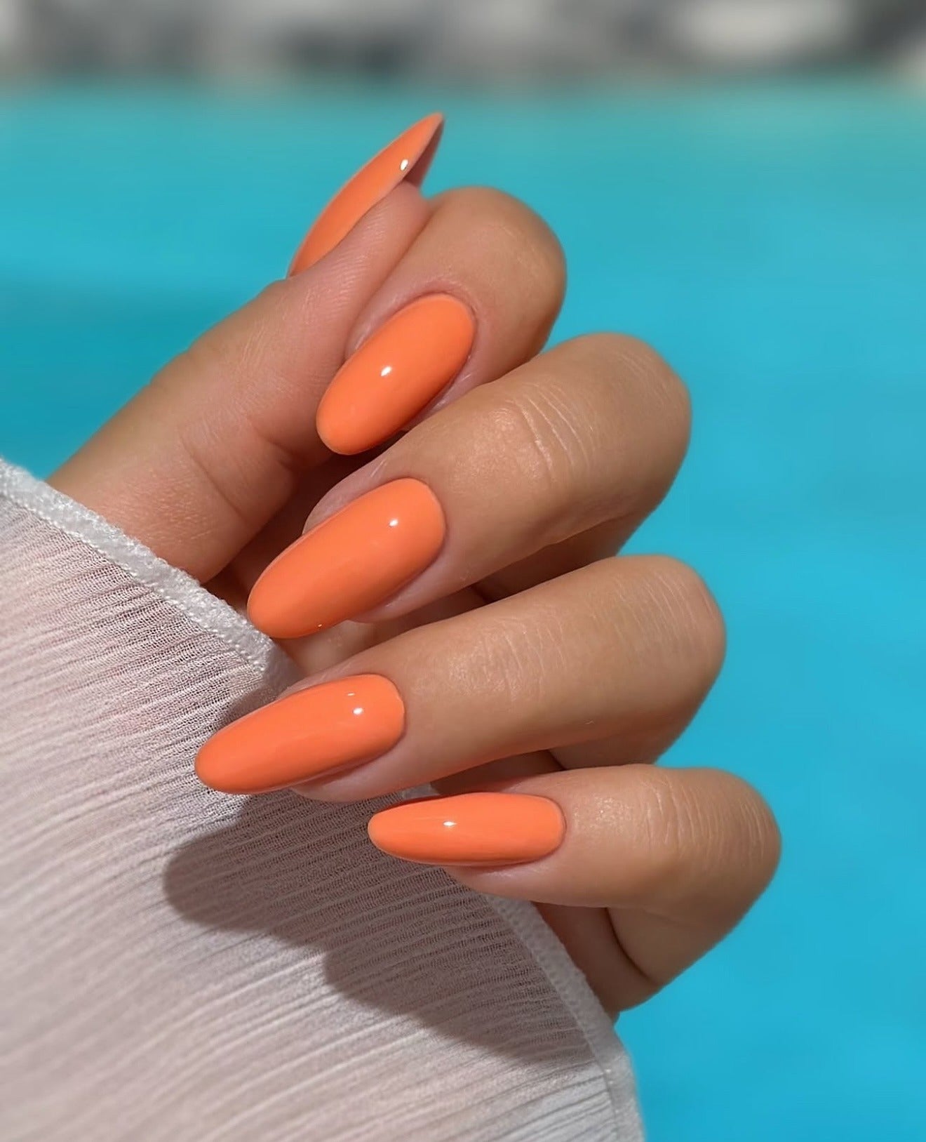6. Soft Tangerine Almond Nails (Orange Color Nail Ideas)