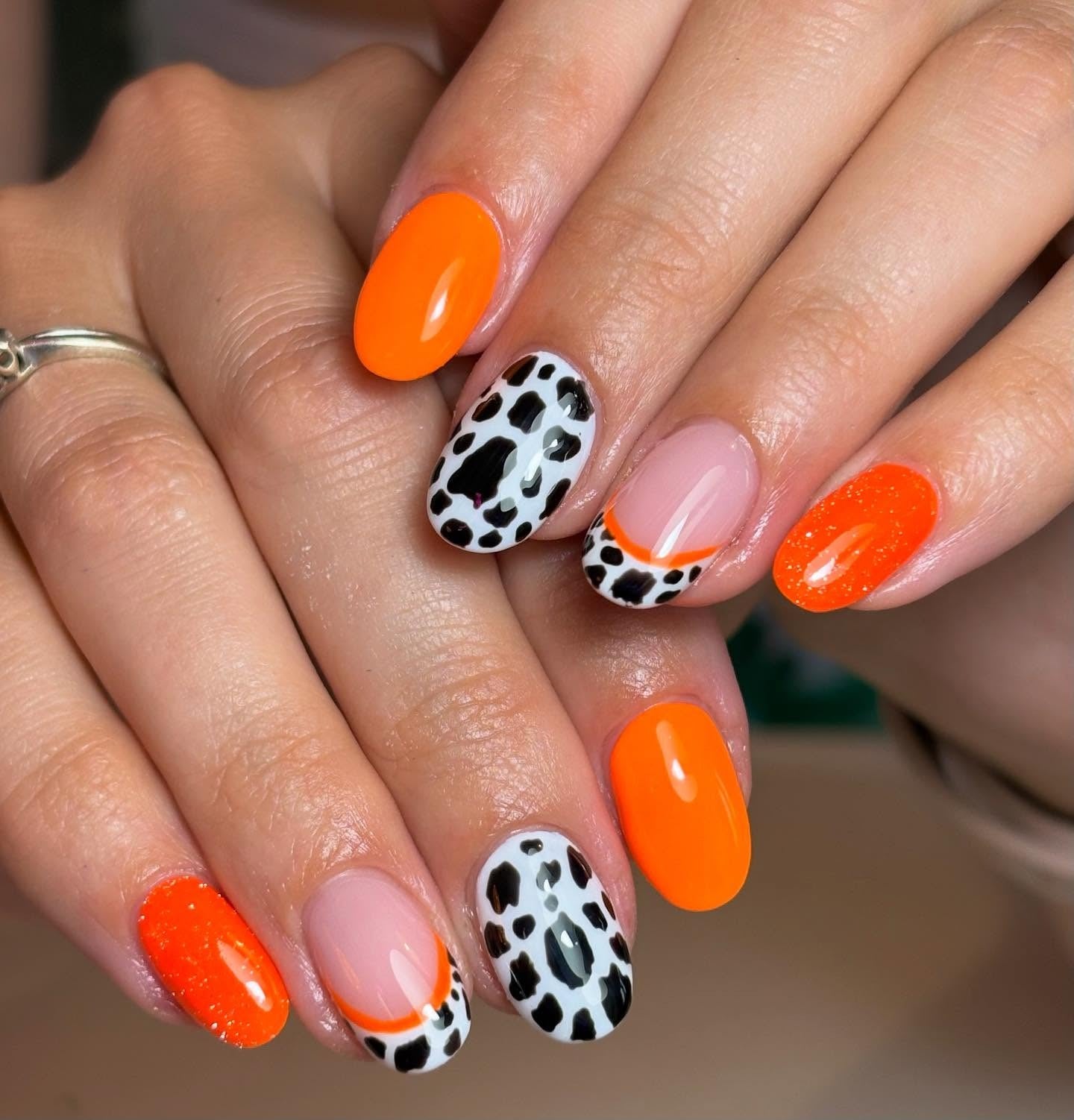 9. Neon Orange and Animal Print Mix Nails (Orange Color Nail Ideas)