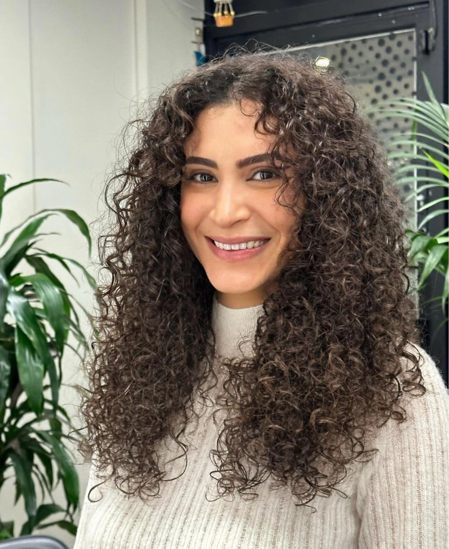 7. Long Layered Curls with Natural Definition (Layered Curly Hairstyles)