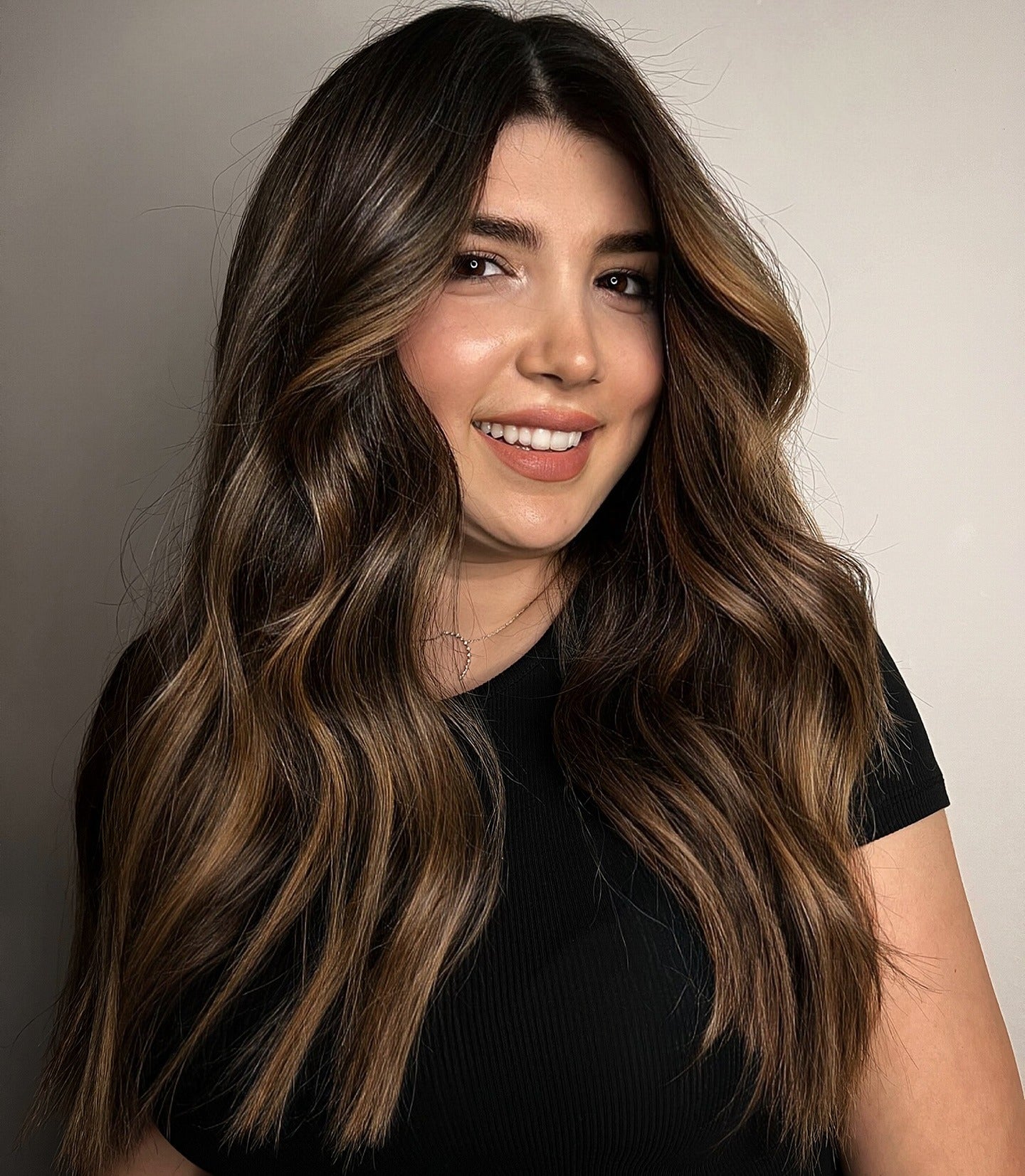 11. Face-Framing Golden Brunette Waves (Brunette Balayage Hair Color)