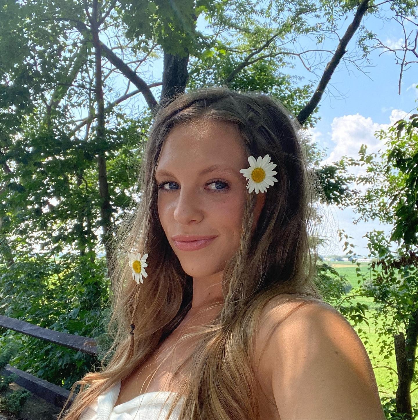 7. Side Braids with Daisies on Light Brown Hair (Summer Hairstyles)