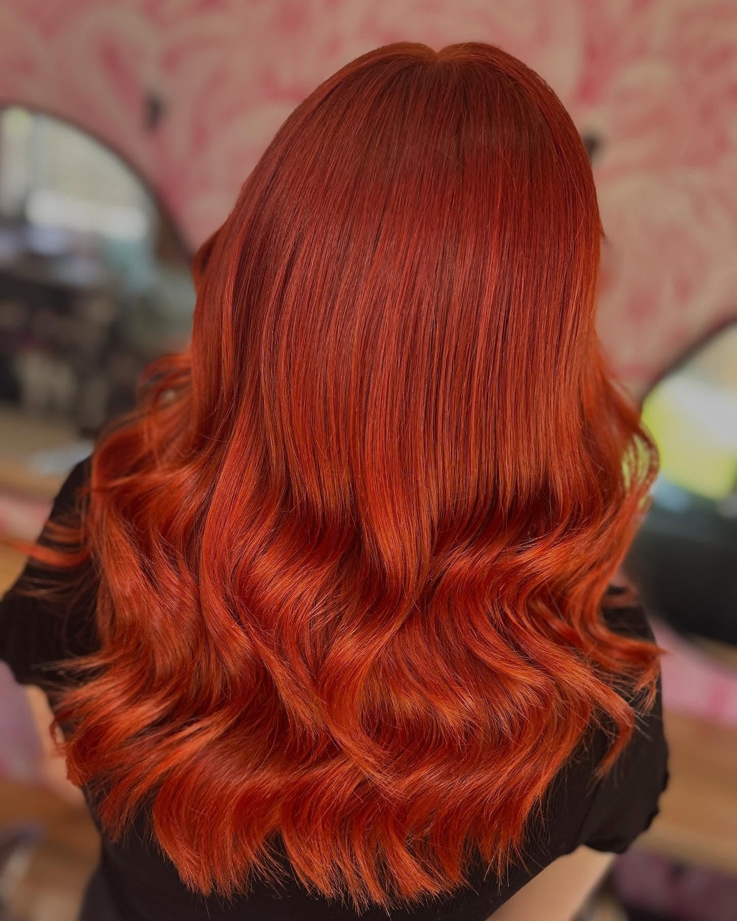 13. Sleek Auburn Orange Medium Waves (Orange Hair Color)