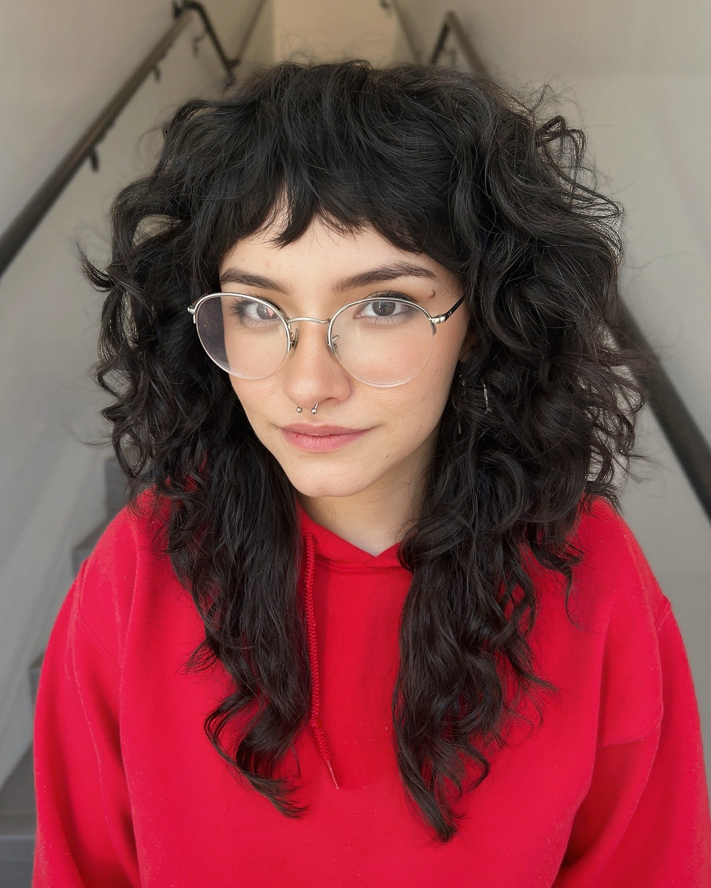 10. Curly Black Mullet with Round Fringe (Shaggy Mullet Haircut)