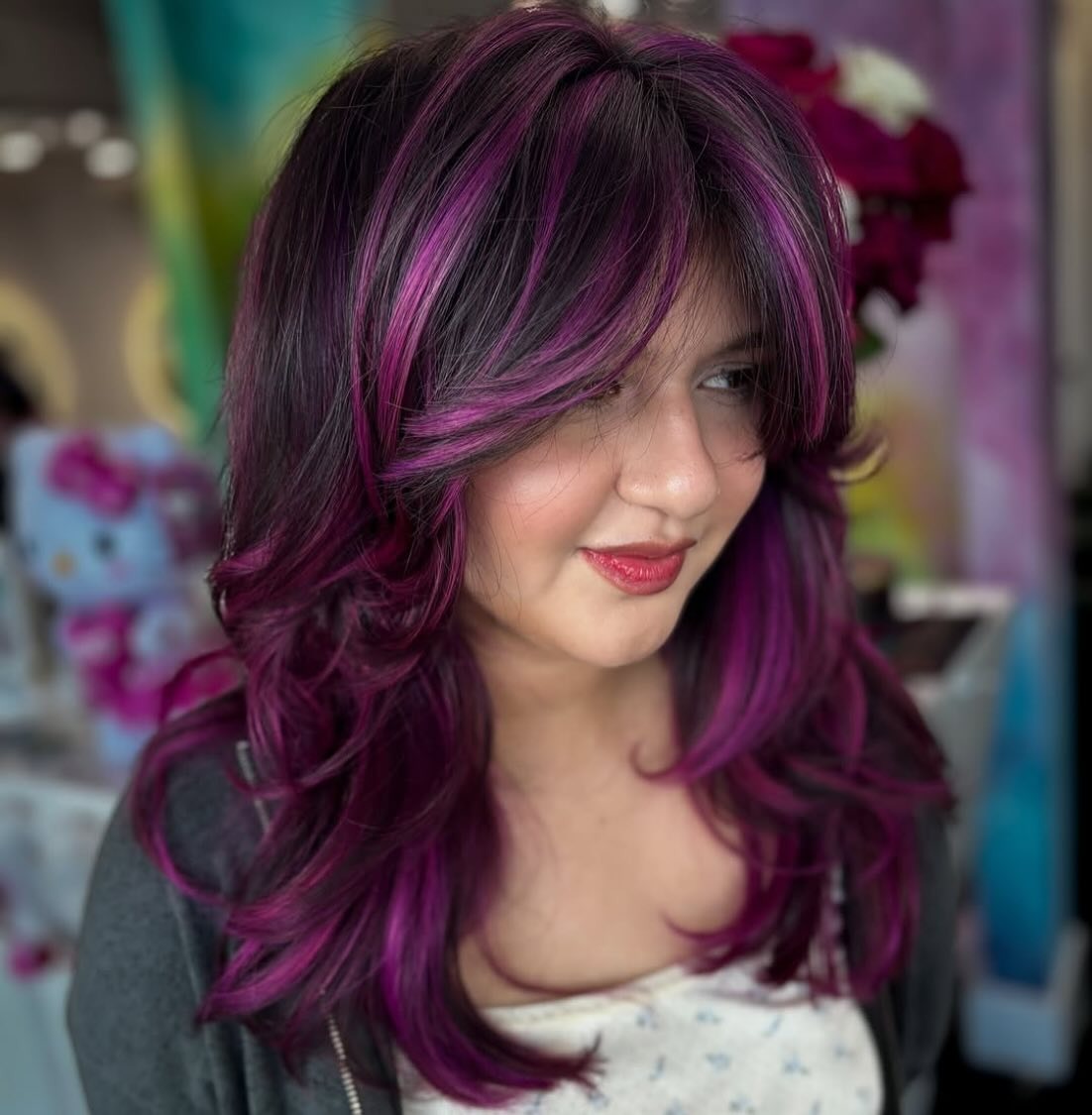 7. Layered Cut with Deep Plum Highlights (Hair Color with Highlights)