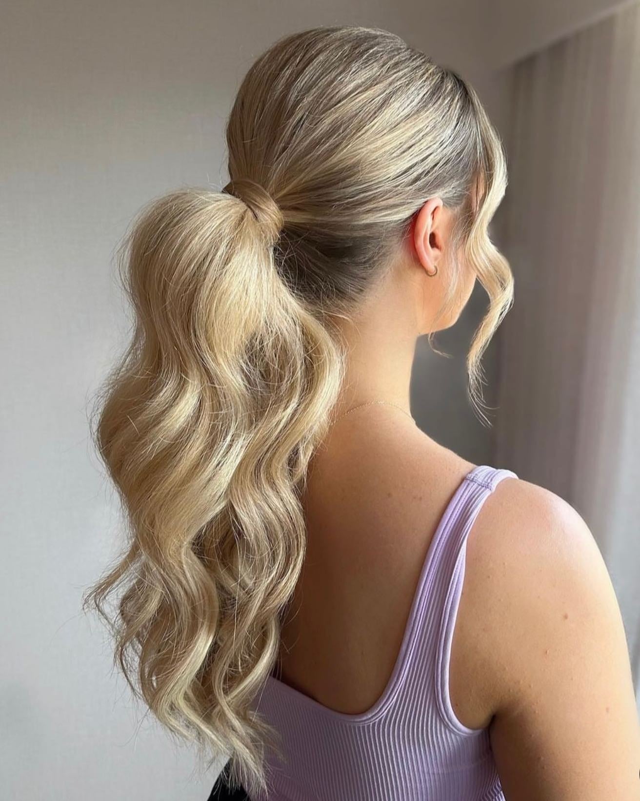 2. Voluminous Blonde Ponytail with Waves (Elegant Hairstyles)
