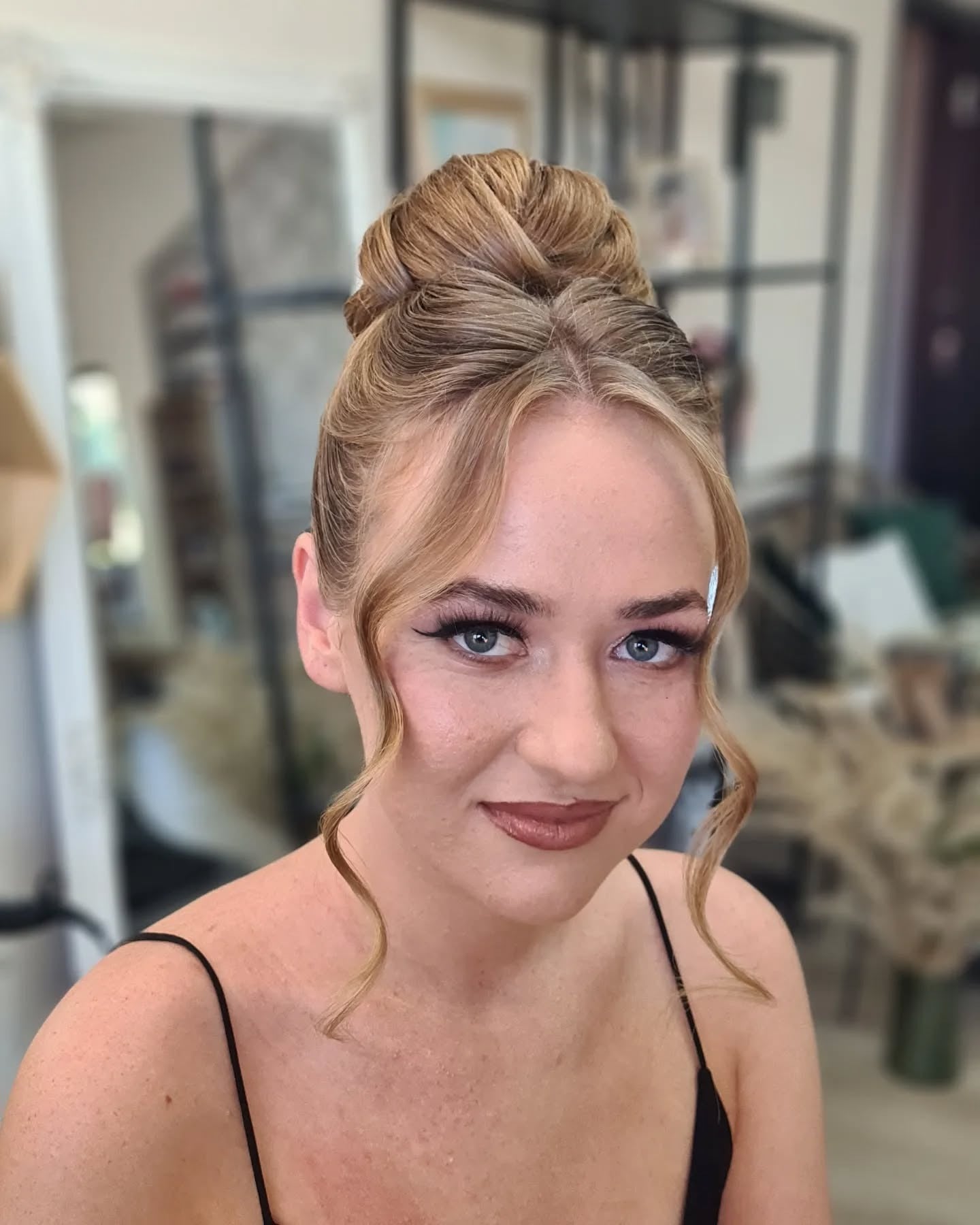 13. High Bun with Framing Curls and Highlights (Elegant Hairstyles)