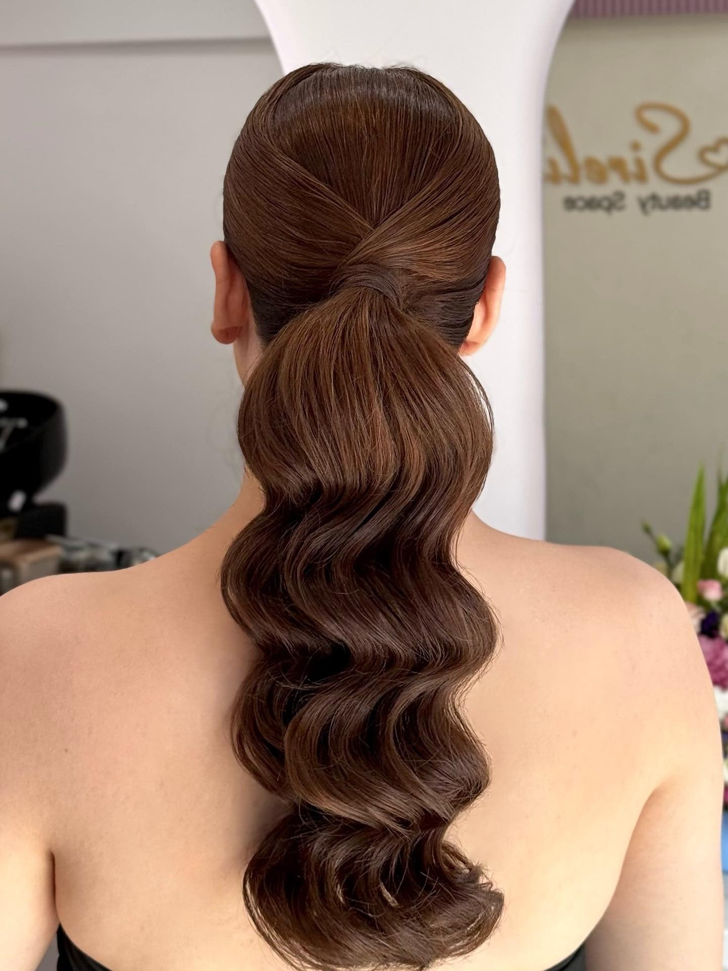 14. Sleek Mid-Ponytail with Sculpted Brunette Waves (Elegant Hairstyles)