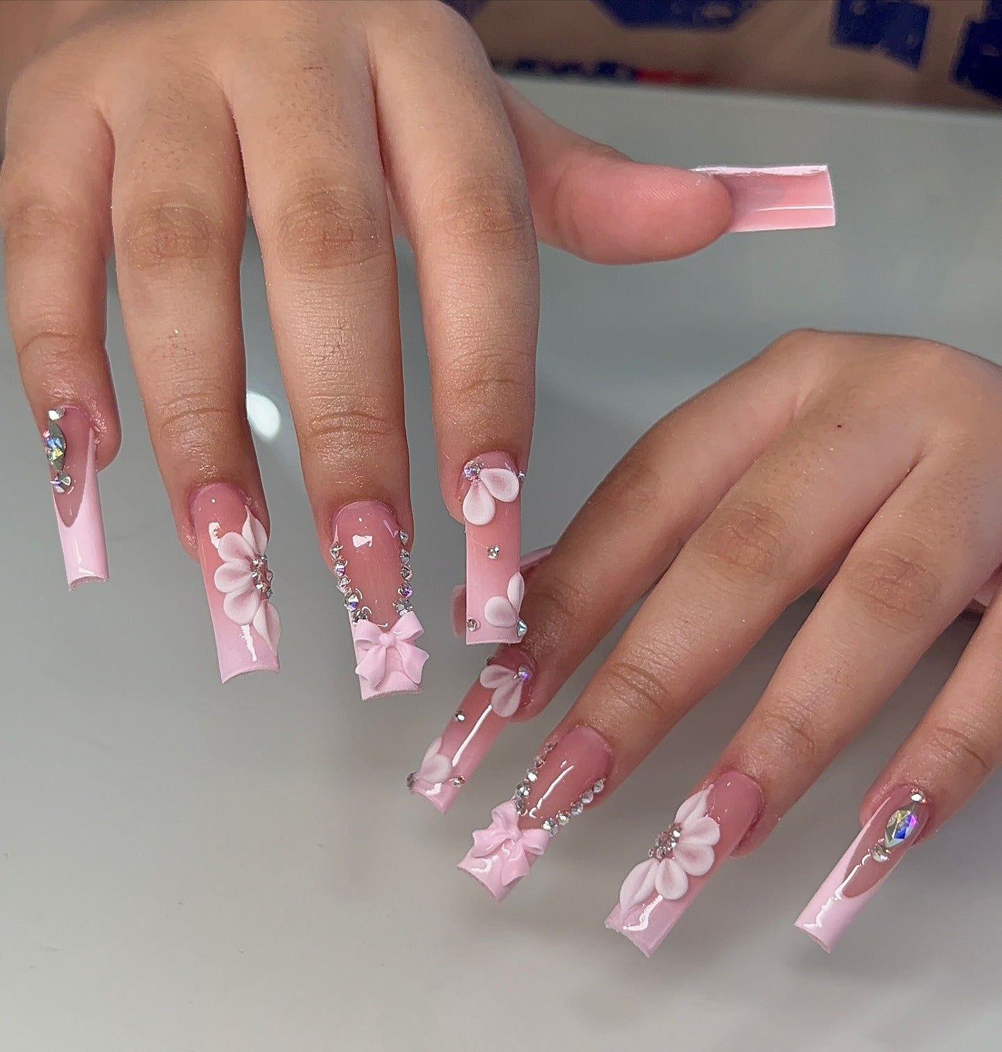 7. Classic French with Pink Flower Accent (Small Coffin Nail Ideas)