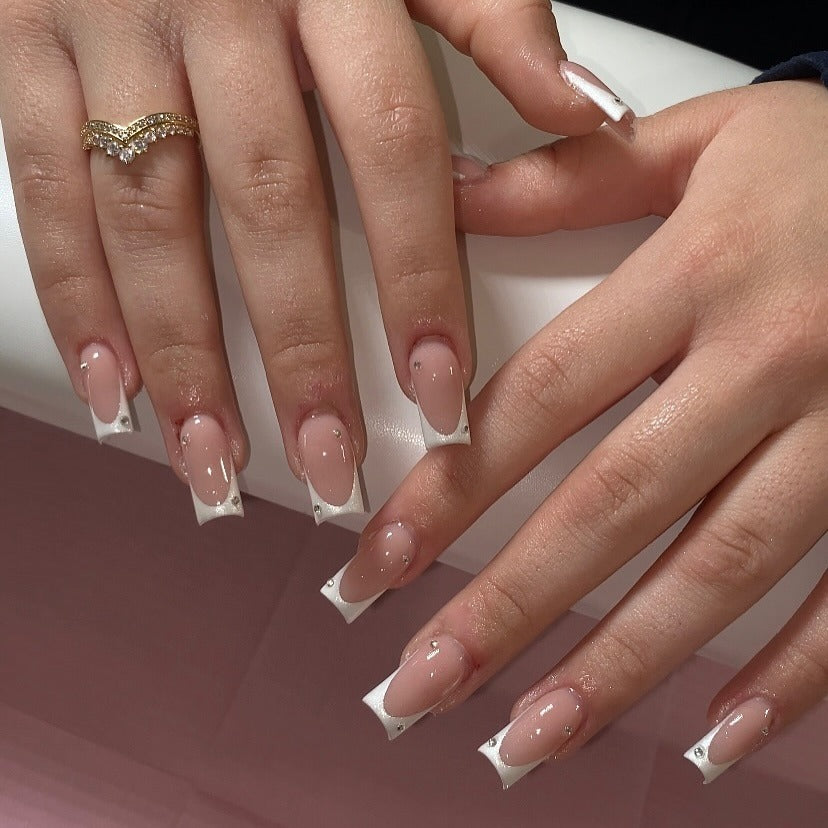 12. White French with Daisy Accents and Crystals (Small Coffin Nail Ideas)
