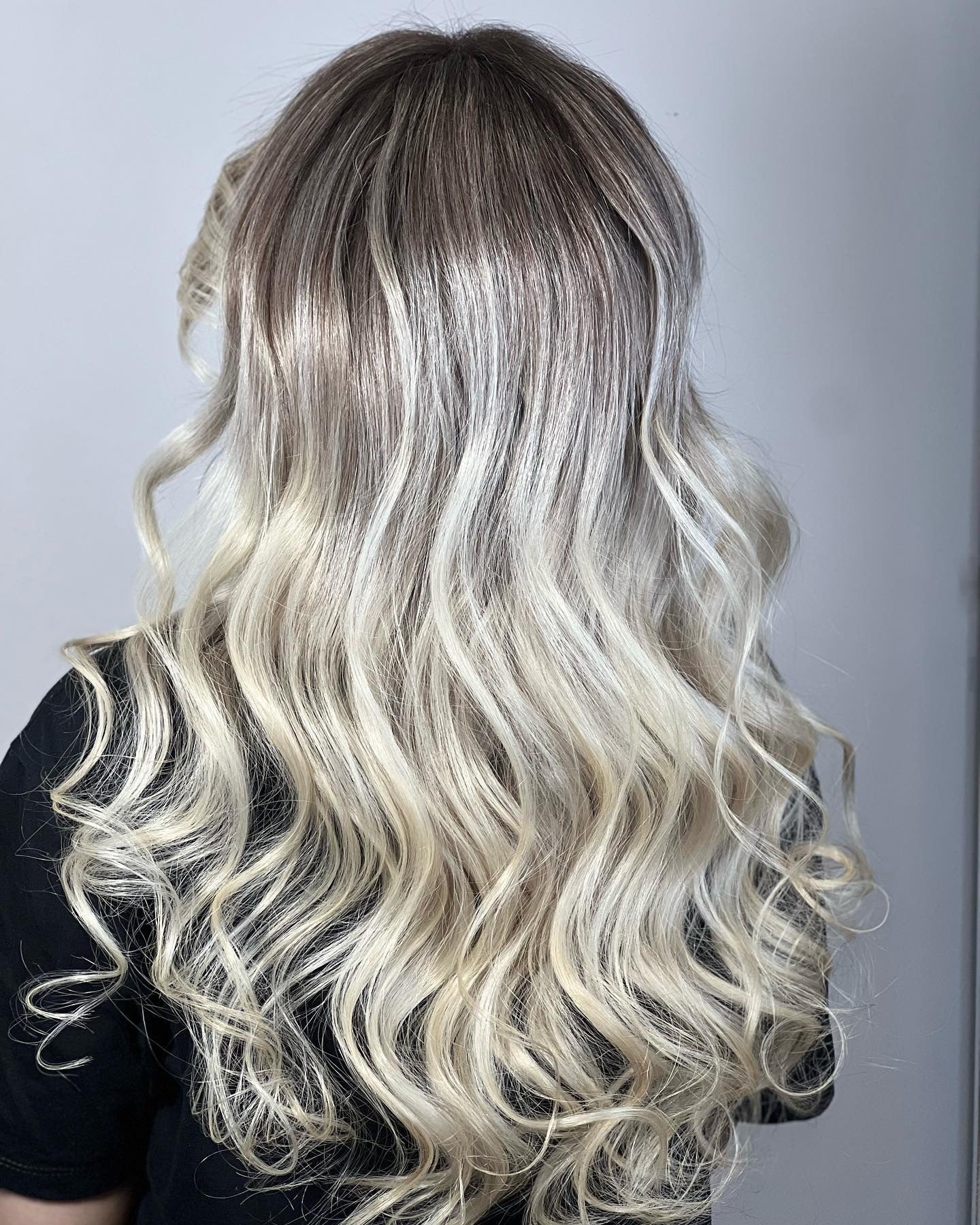 6. Platinum Melt with Root Fade (Light Hair Color)