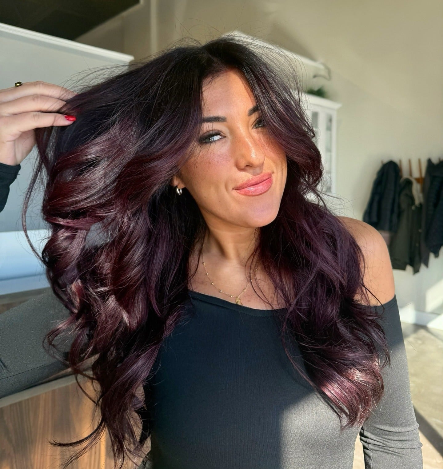 7. Voluminous Plum Layers with Soft Curls (Plum Hair Color)