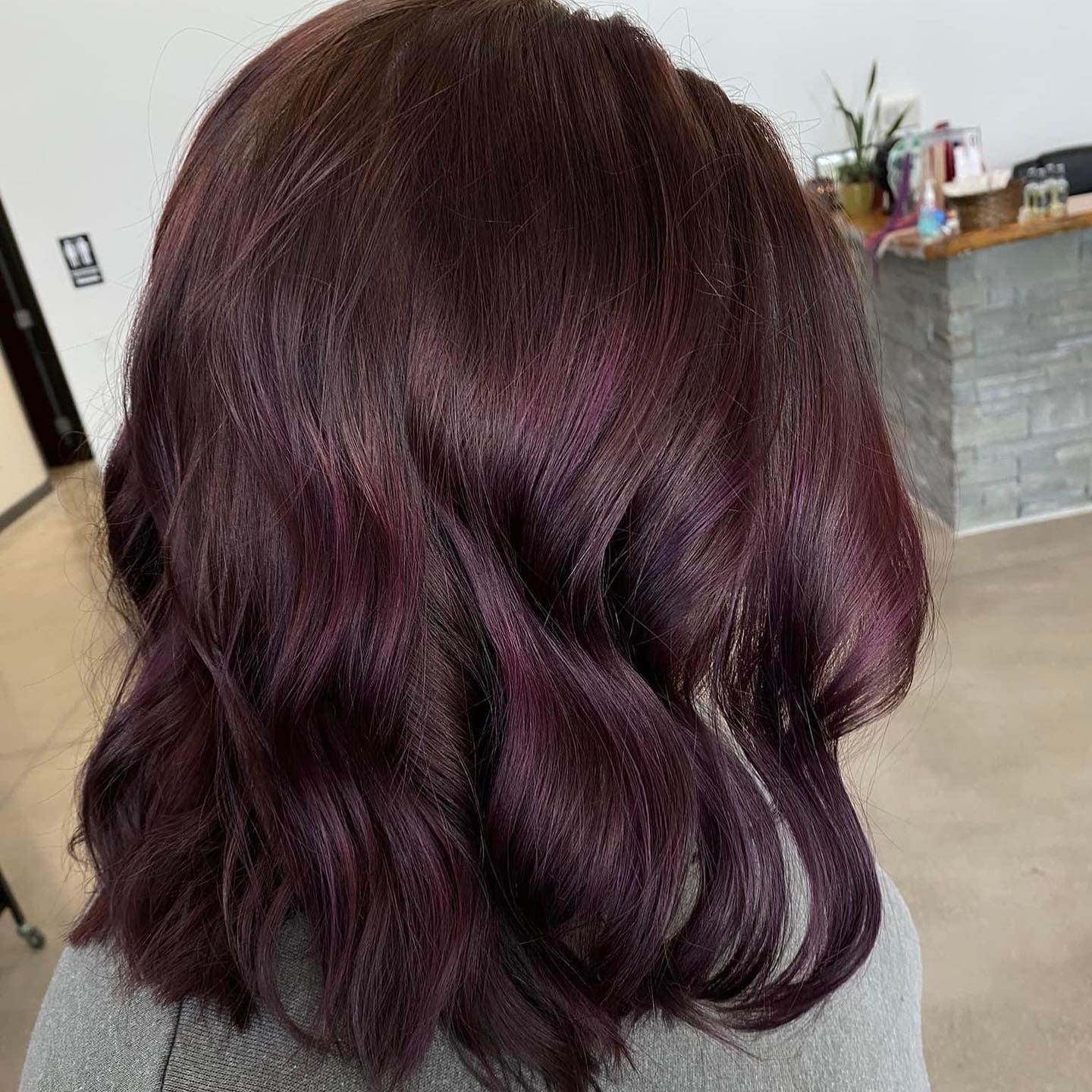 13. Plum Shoulder-Length Waves with Dimension (Plum Hair Color)