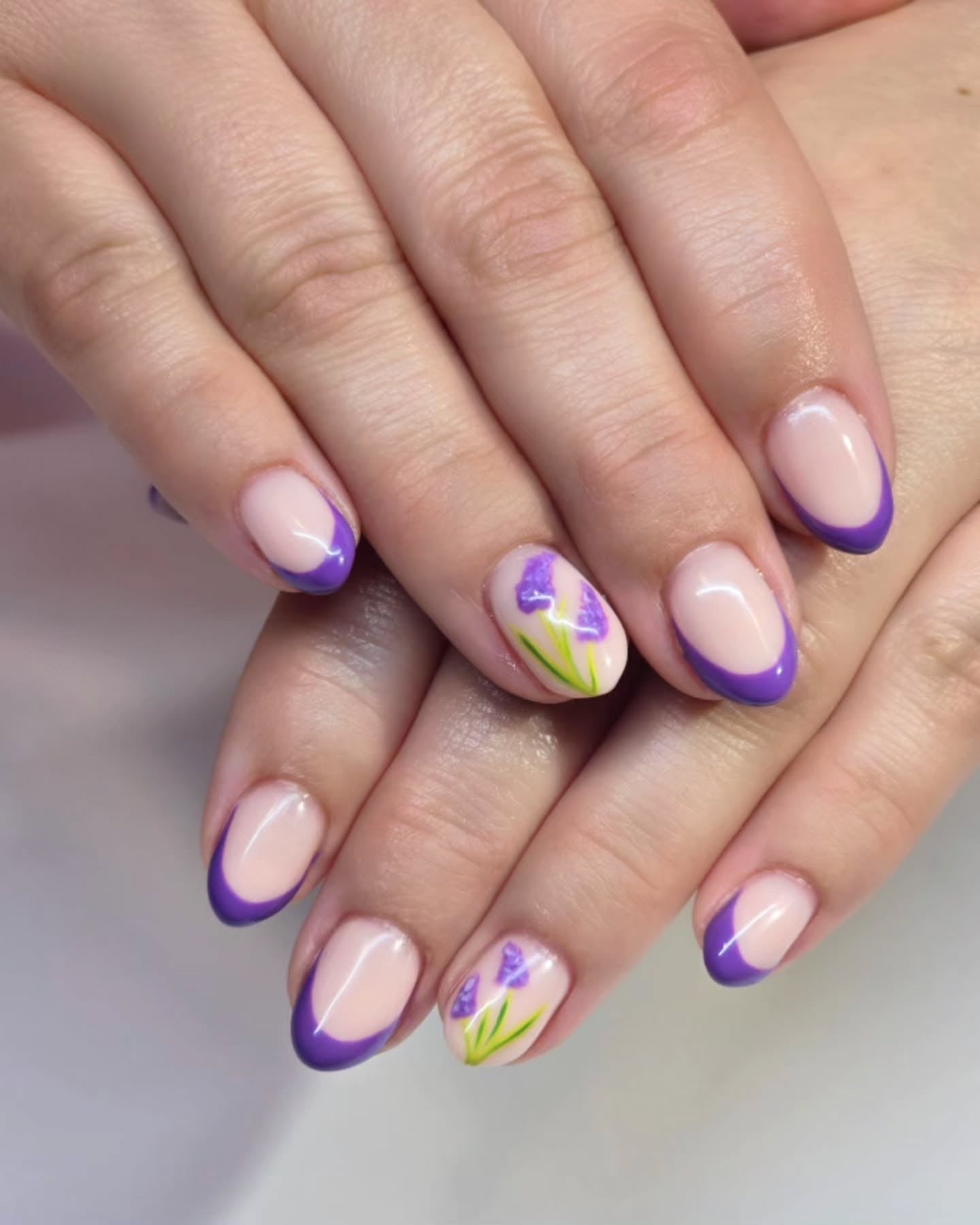 1. Lavender French Tips with Floral Accents (Purple Nail Ideas)