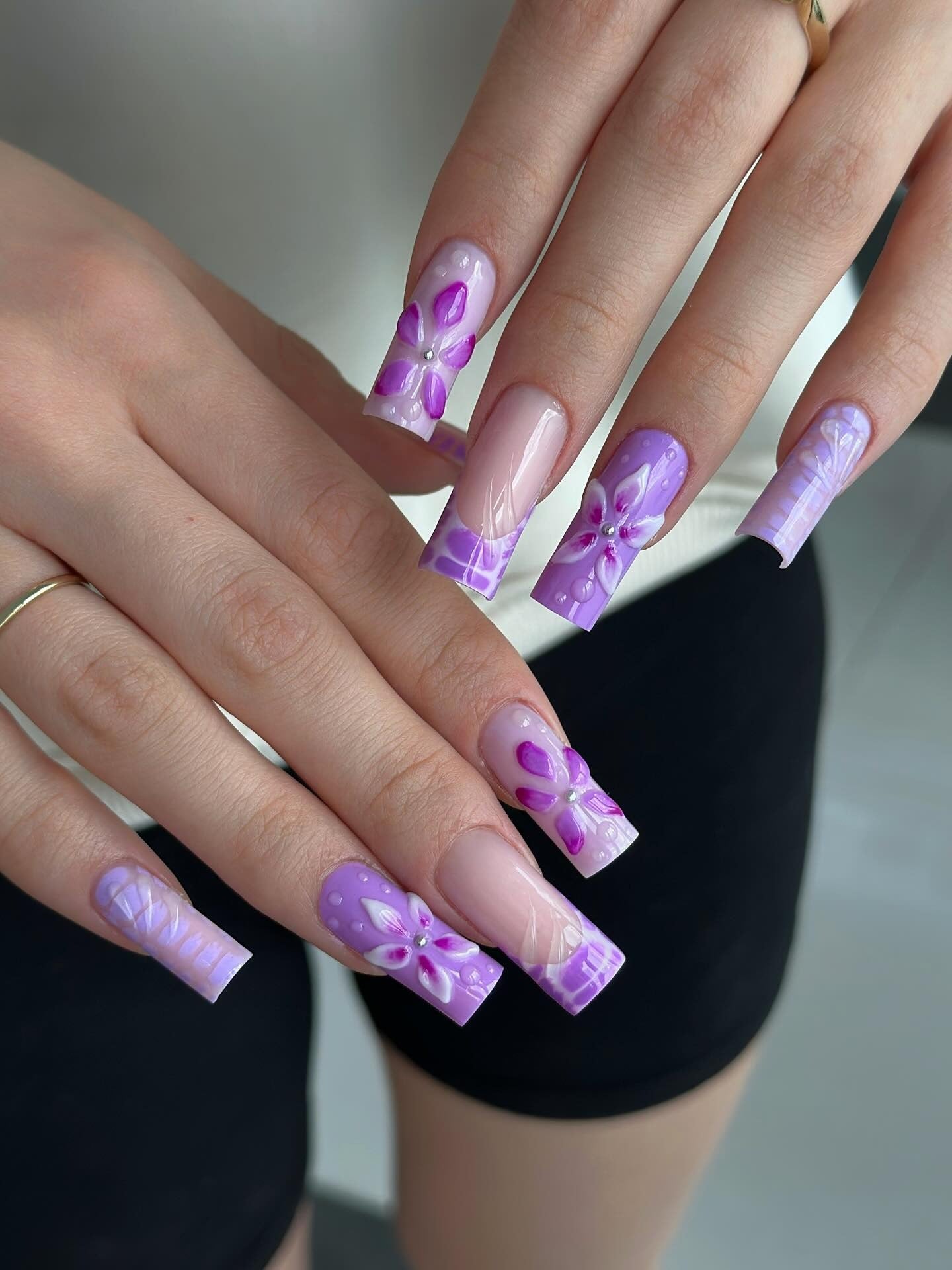 13. Glossy Purple Petal Art on Coffin Nails (Purple Nail Ideas)