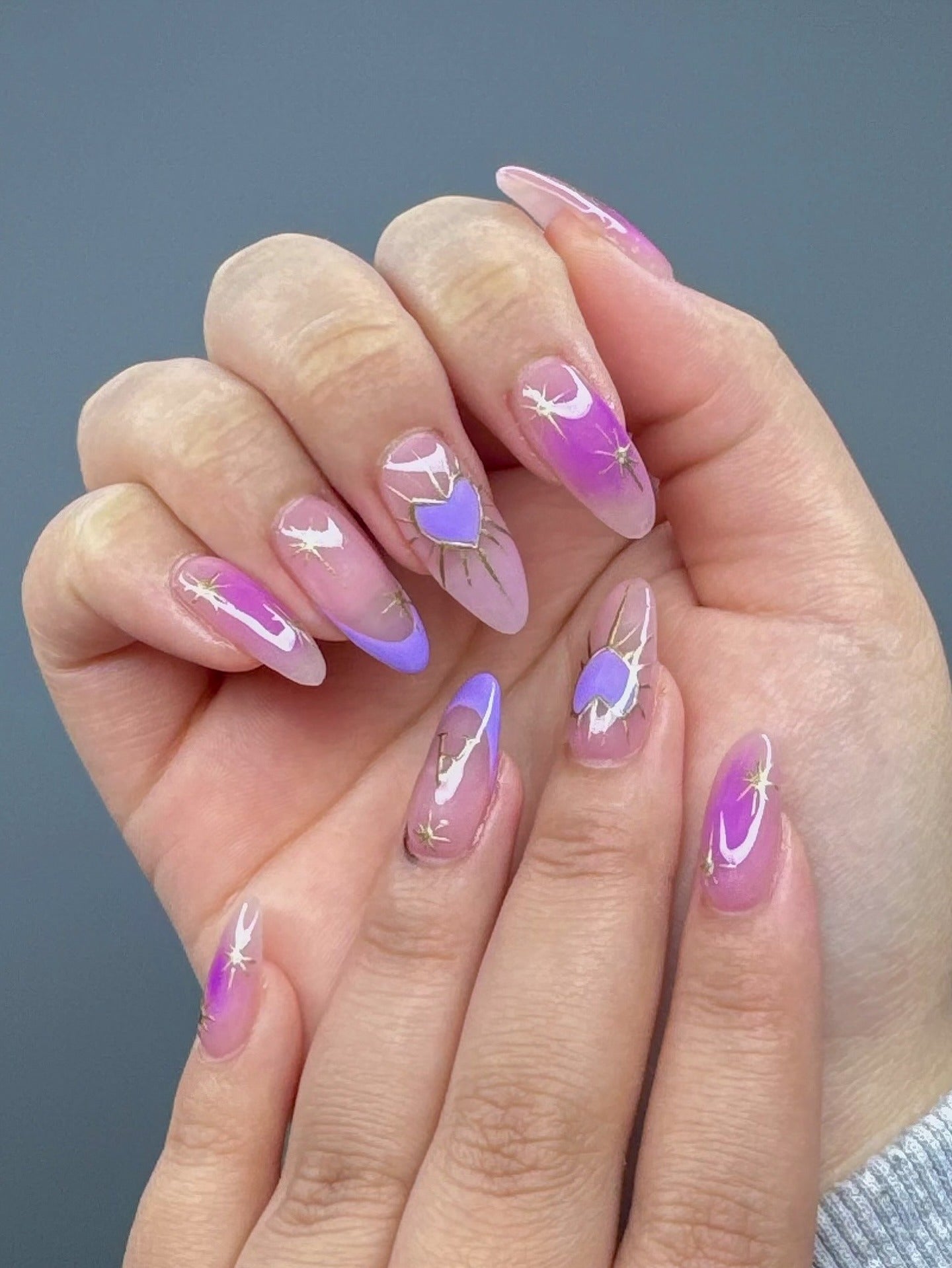 14. Violet Aura Nails with Celestial Gold Art (Purple Nail Ideas)