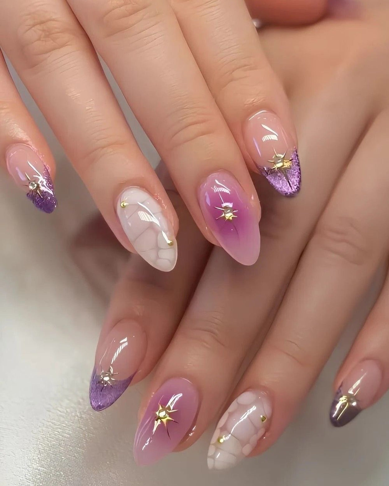 15. Cracked Marble and Glitter French with Gold Stars (Purple Nail Ideas)