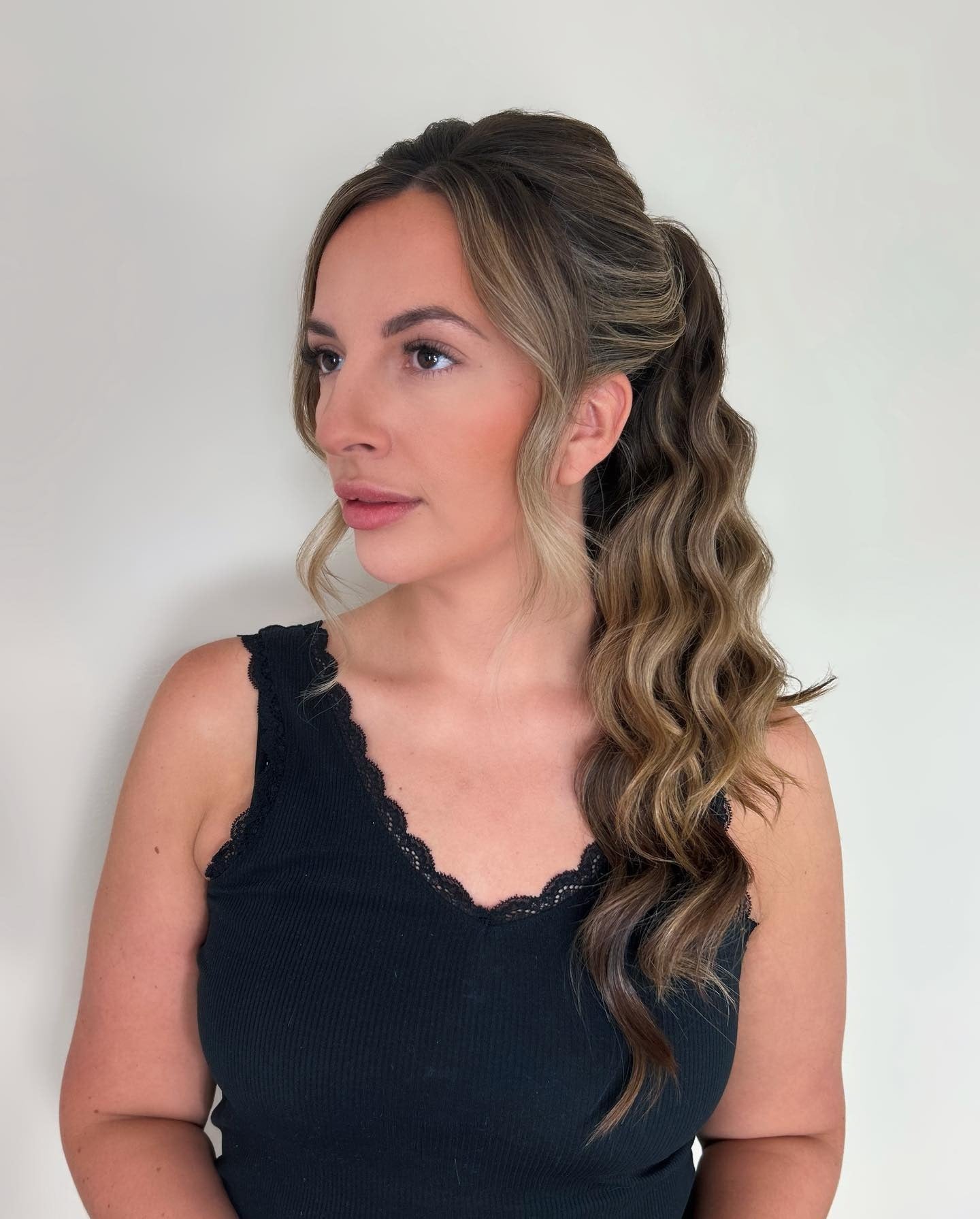 7. Half-Wave Ponytail with Face-Framing Strands – Ash Brown with Highlights (Ponytail Hairstyles)