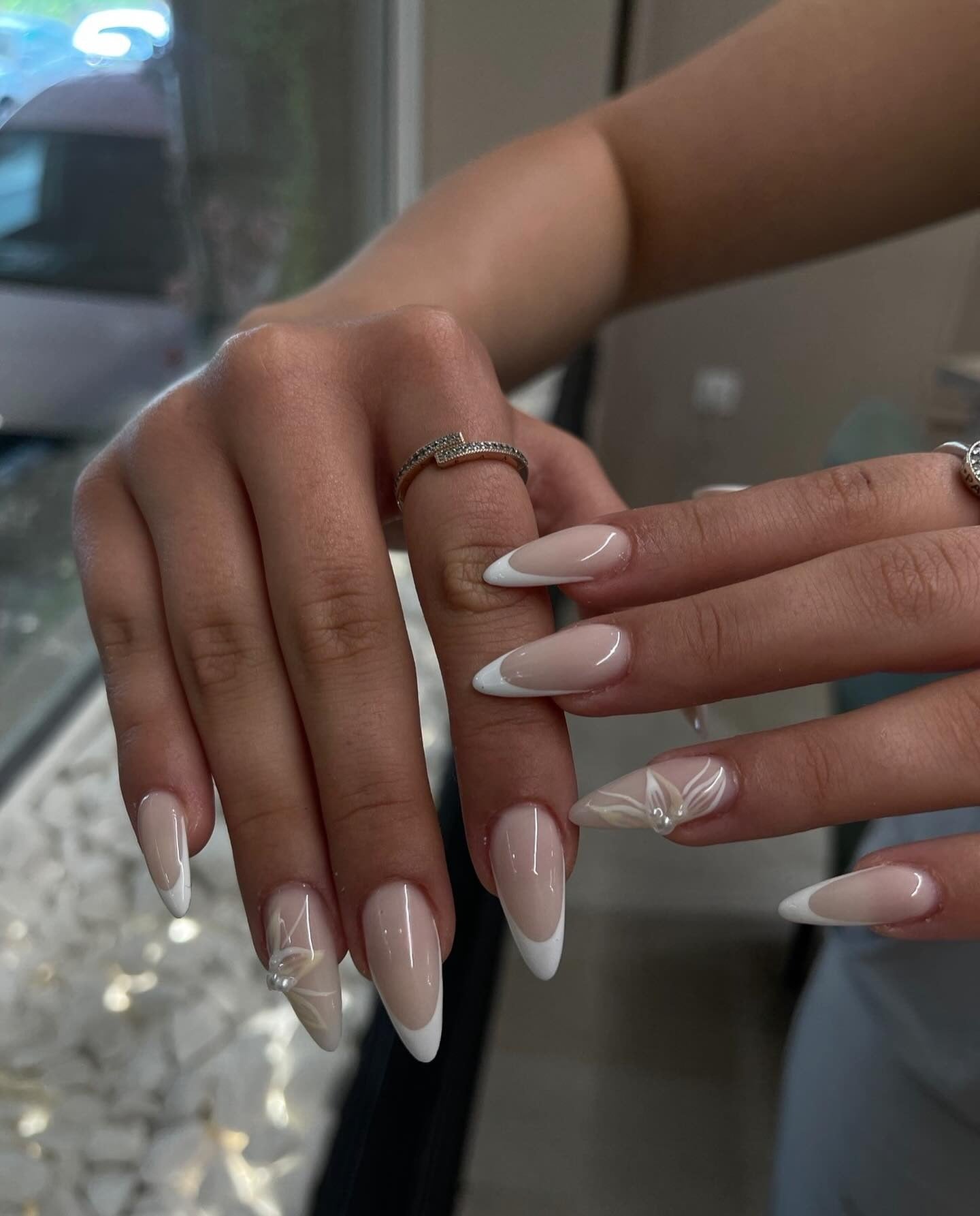 2. Almond French with Subtle 3D Flowers (White Tip Nail Ideas)