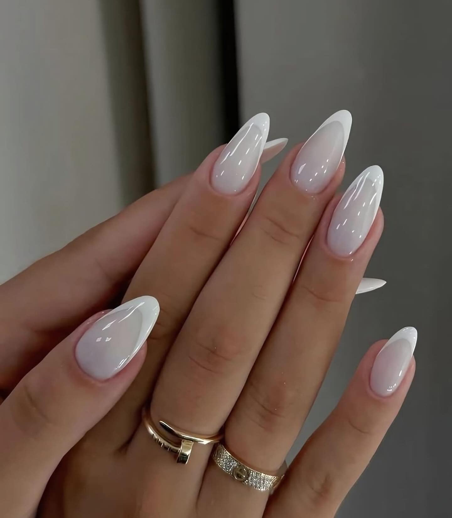 12. Glossy Almond White Tips (White Tip Nail Ideas)