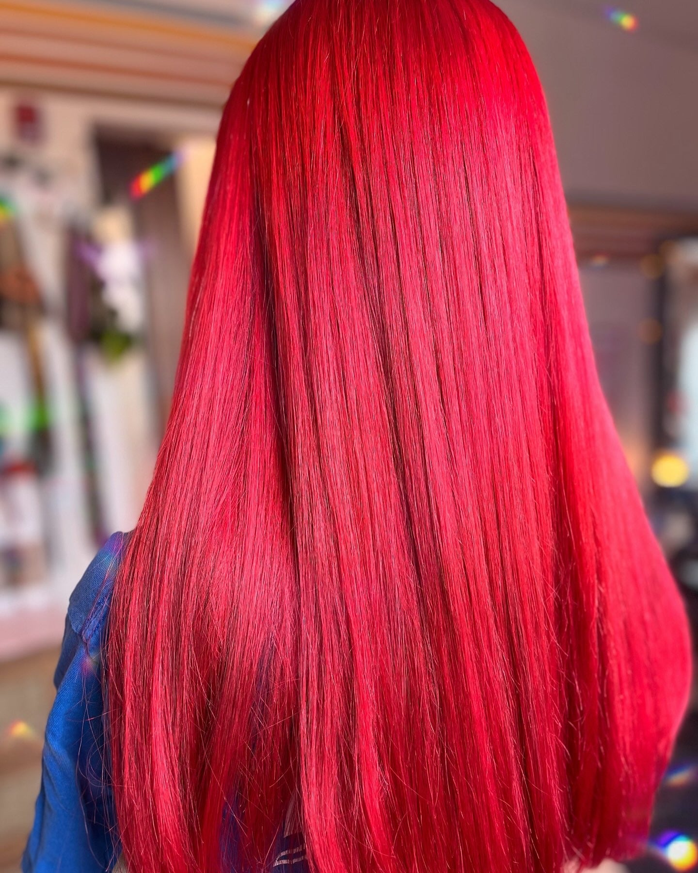 8. High-Impact Straight Cut in Neon Red (Red Hair Color)