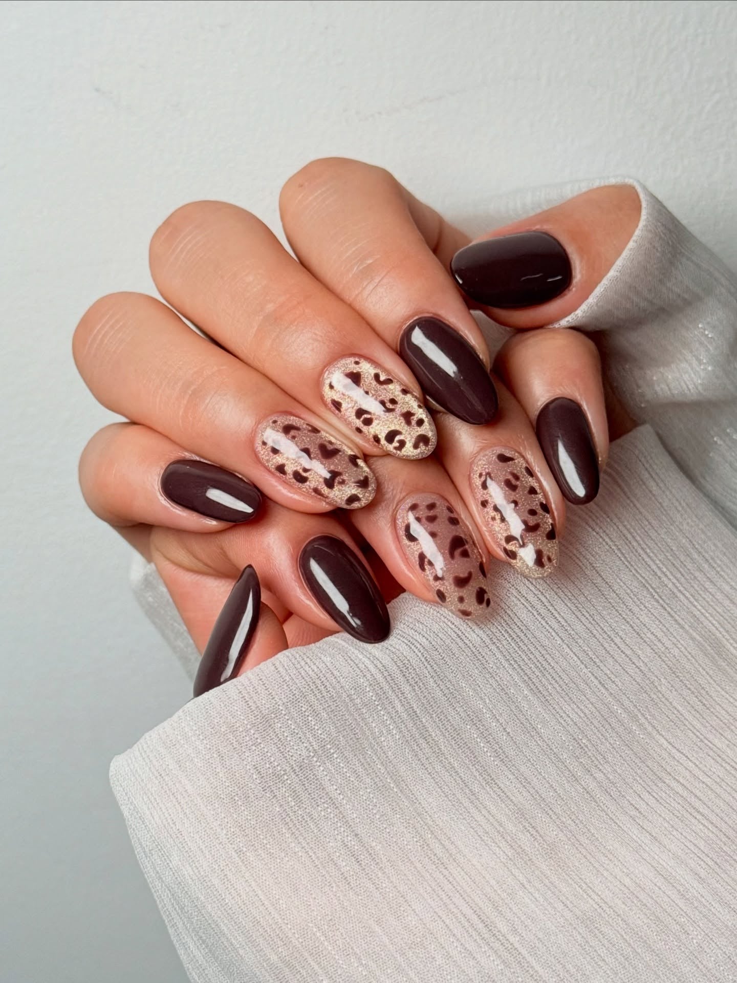 1. Dark Chocolate with Leopard Accents (Brown Nail Ideas)