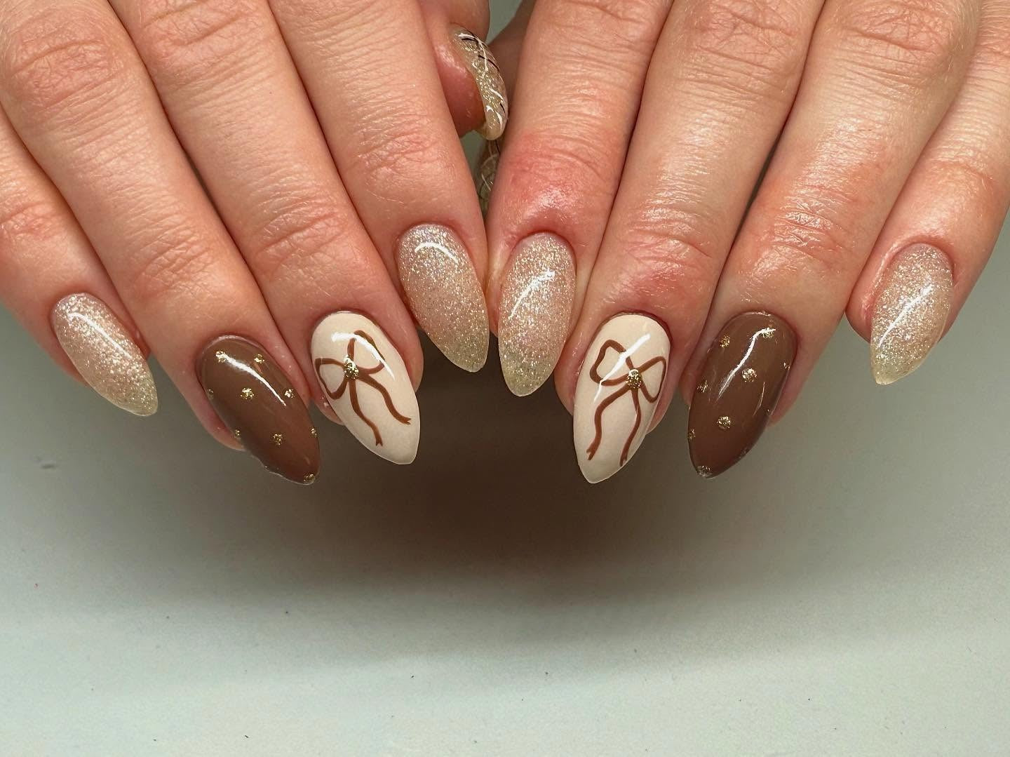 8. Golden Bow Accent Nails (Brown Nail Ideas)