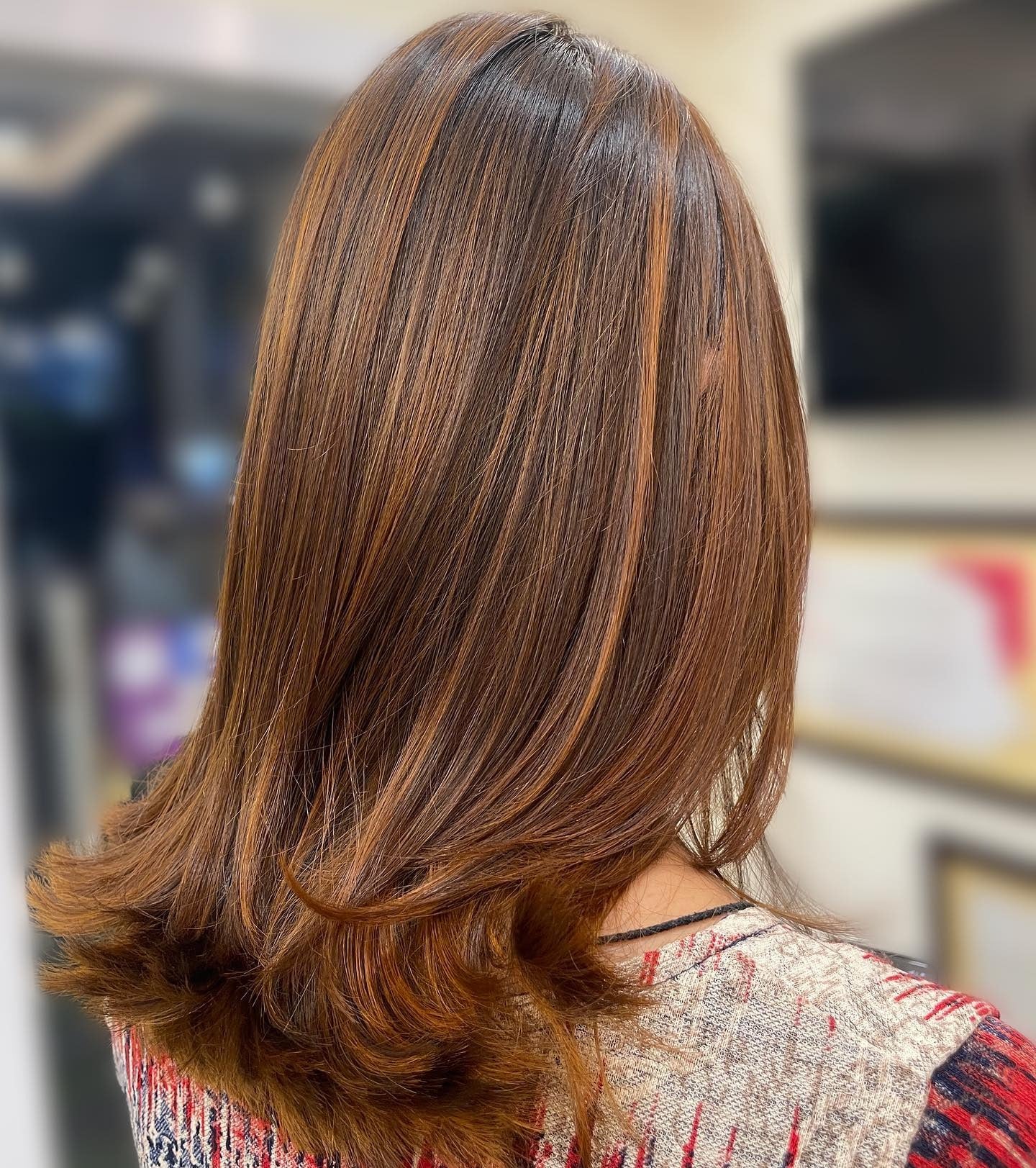 4. Layered Chestnut Lob with Soft Curls (Chestnut Hair Color)