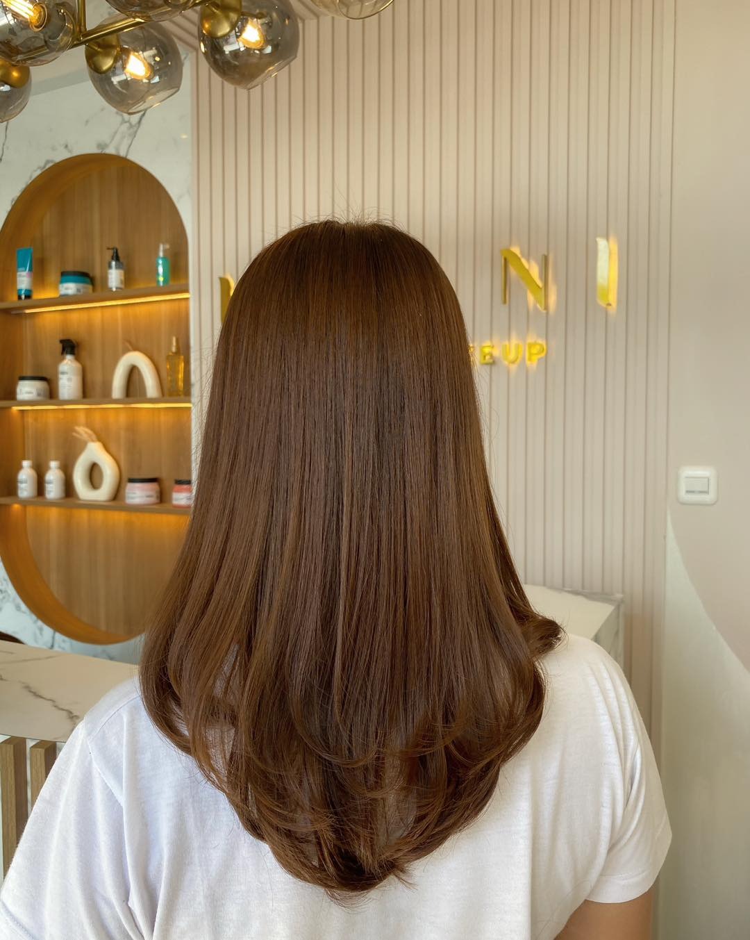 10. Classic Straight Chestnut Layers with Flip Ends (Chestnut Hair Color)