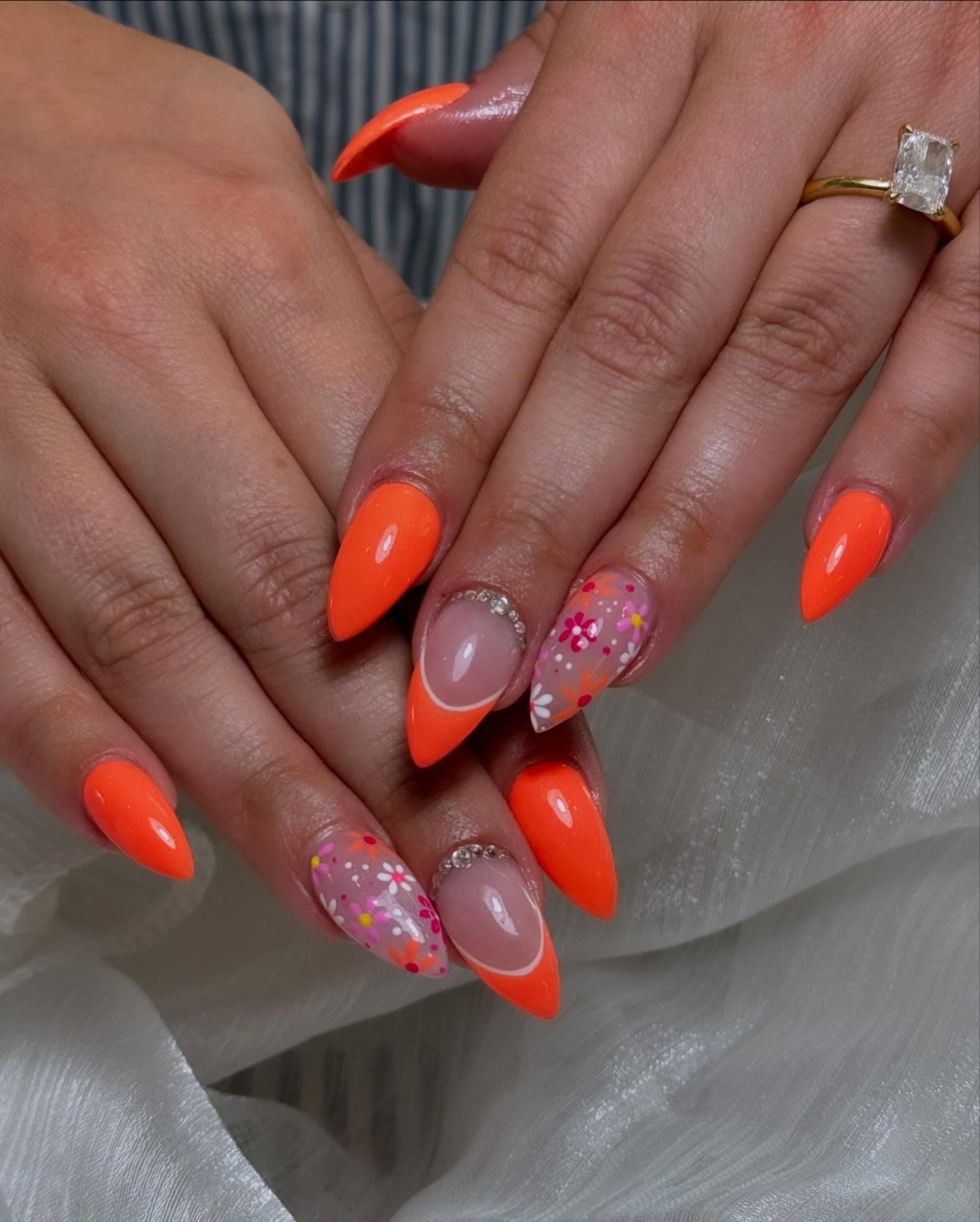 14. Neon Orange Bloom Burst (Flower Nail Ideas)