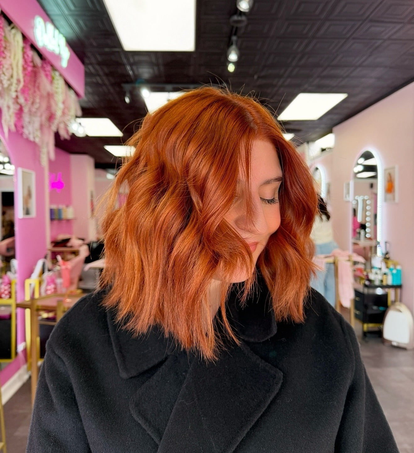 9. Wavy Copper Bob with Deep Side Part (Copper Hair Color)
