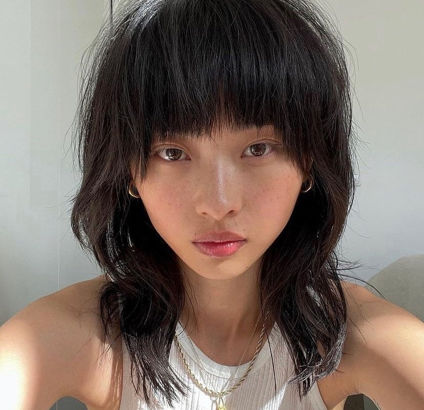 3. Piecey Wolf Cut with Blunt Fringe (Wolf Haircuts)