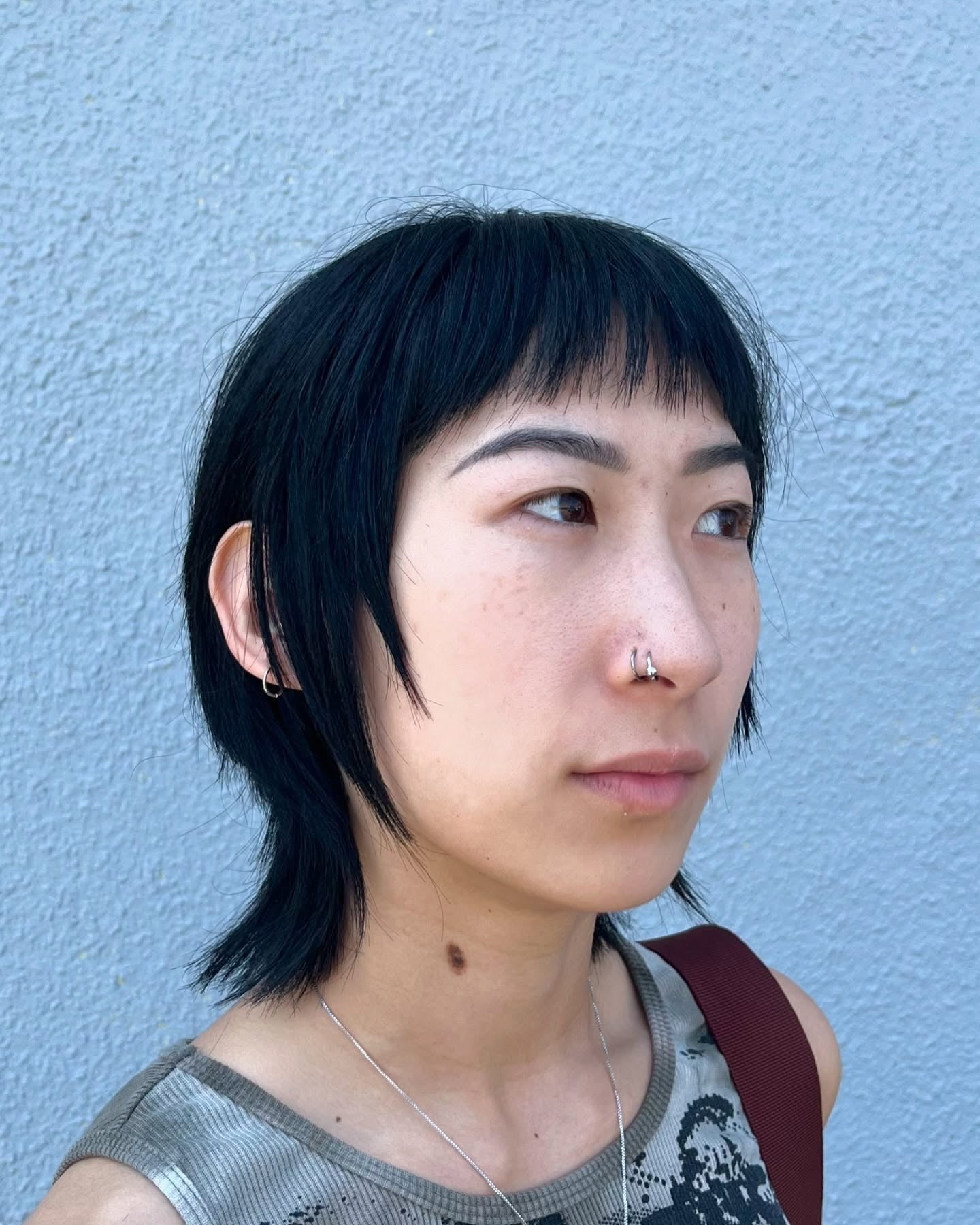 15. Razor Cut Jet Black Wolf Style with Blunt Fringe (Wolf Haircuts)