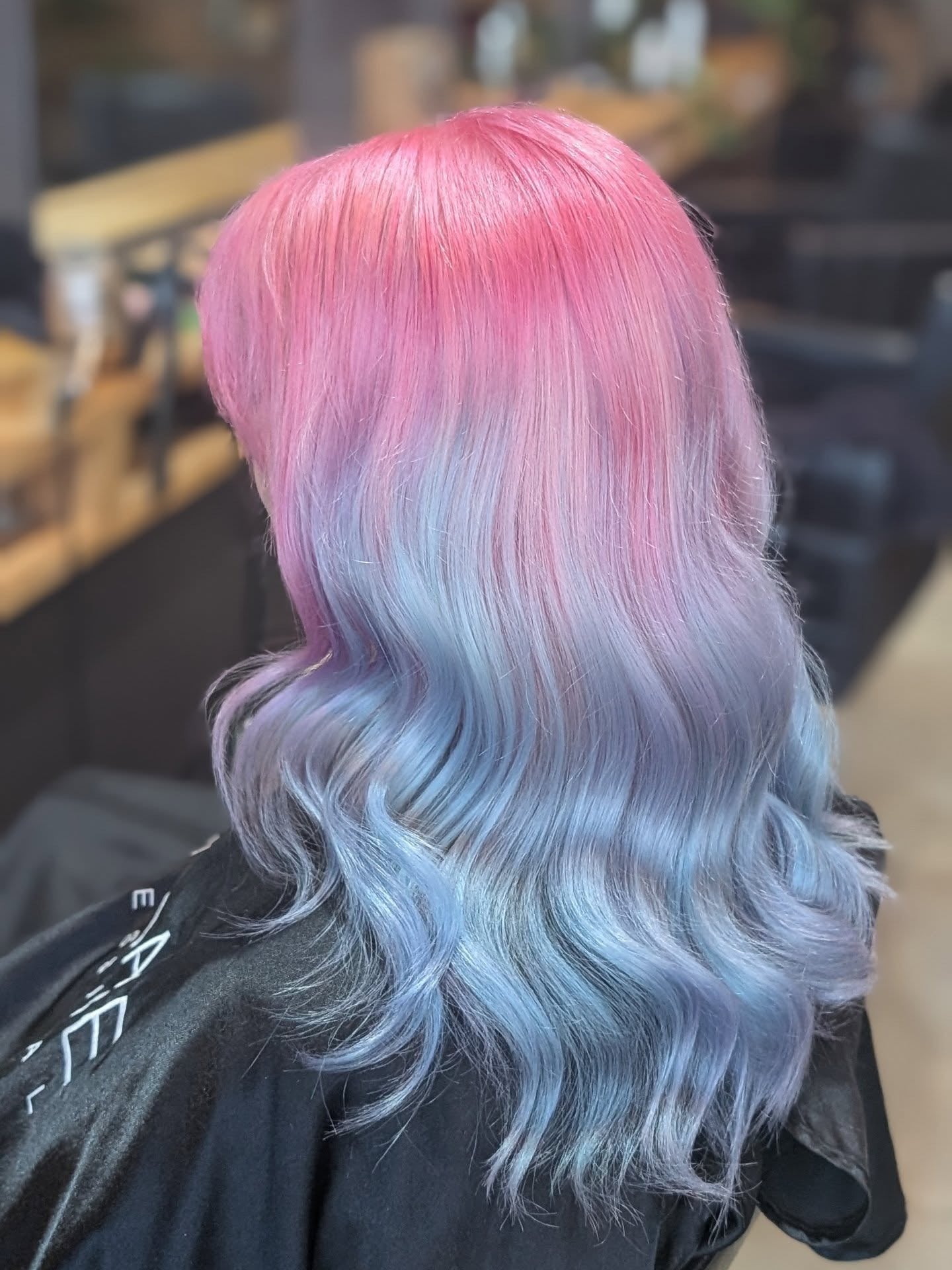 5. Pink-to-Blue Ombre with Glossy Waves (Pastel Hair Colors)
