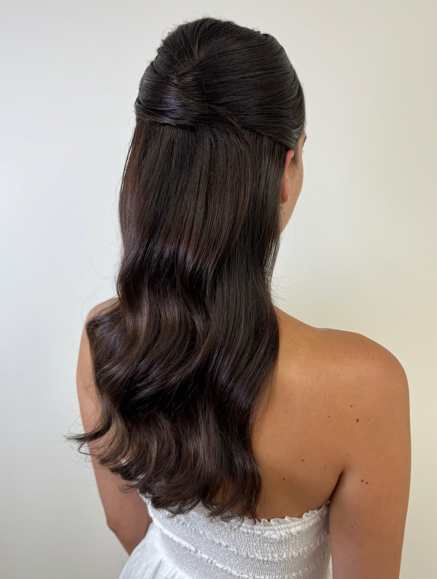10. Polished Half-Up with Glossy Waves (Bride Hairstyles)