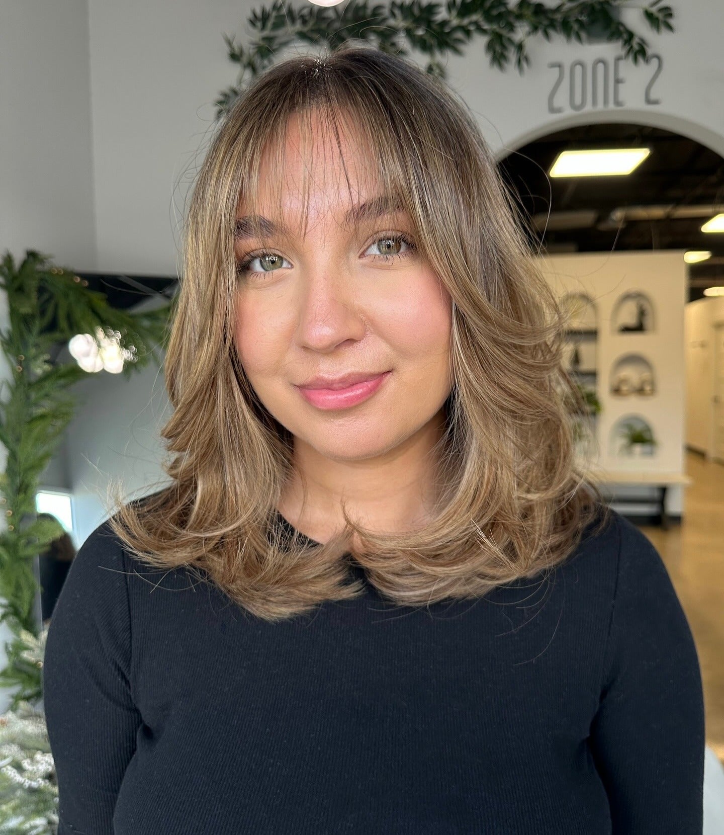 4. Layered Blowout with Wispy Curtain Bangs (Short Layered Haircuts)